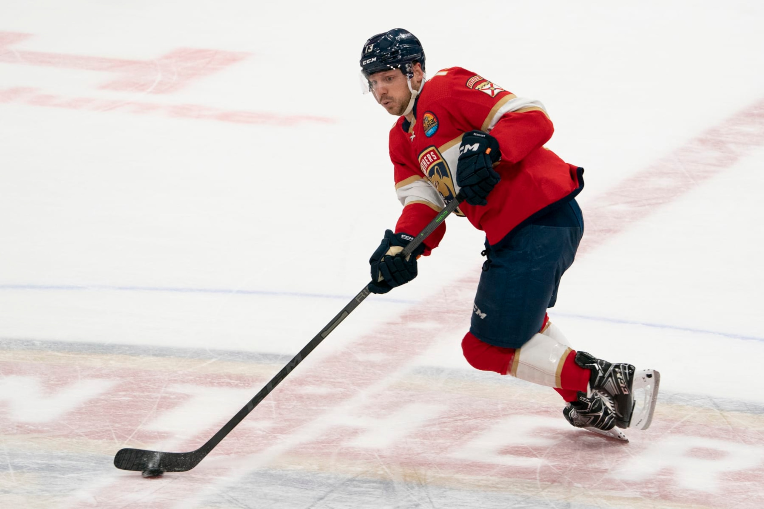 SUNRISE, FL - JANUARY 21: Sam Reinhart #13 of the Florida Panthers skates with the puck during the game between the Florida Panthers and the Minnesota Wild at FLA Live Arean in Sunrise, FL on January 21, 2023. (Photo by Jason Mowry/Icon Sportswire via Getty Images)