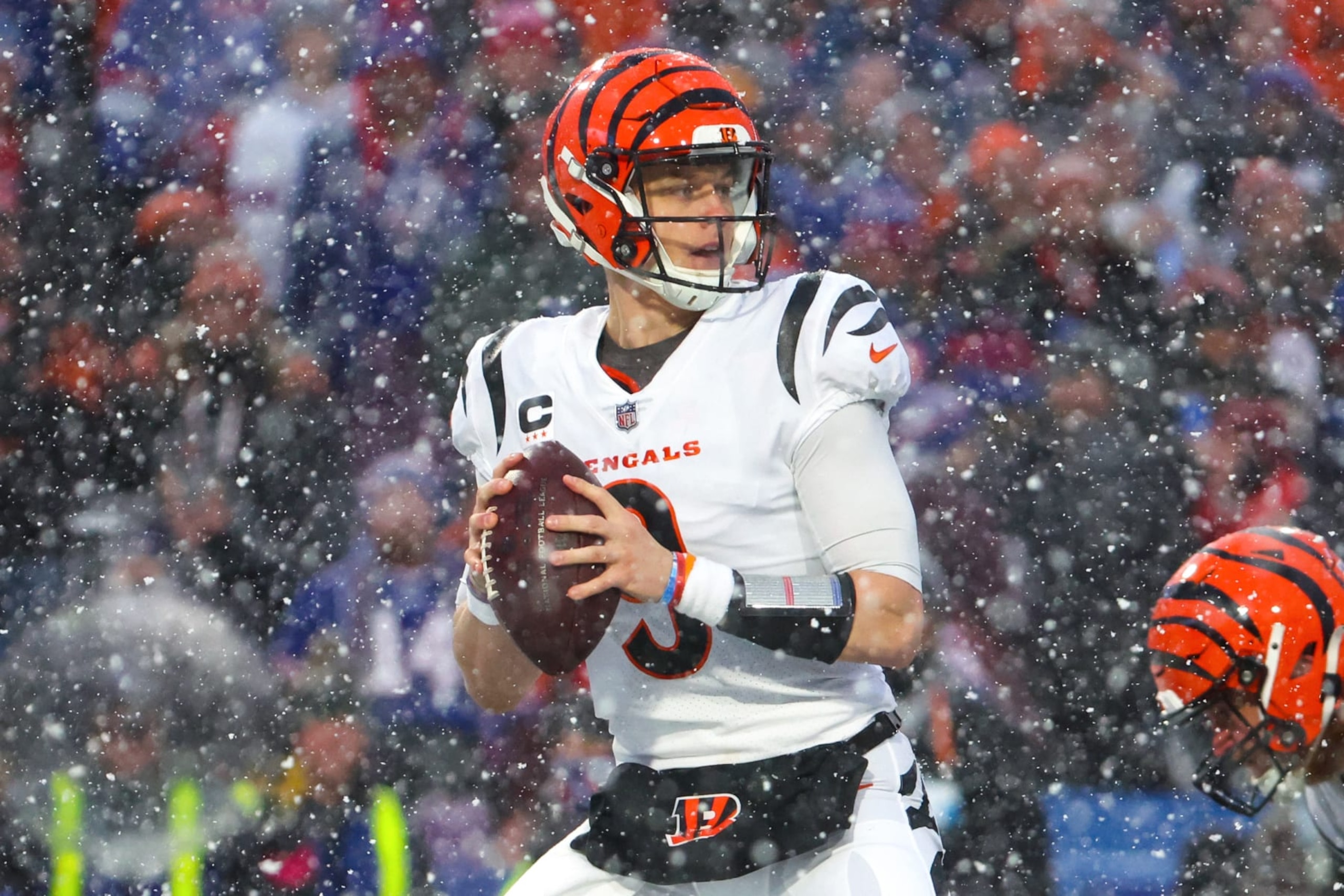 ORCHARD PARK, NEW YORK - JANUARY 22: Joe Burrow #9 of the Cincinnati Bengals looks to pass against the Buffalo Bills during the second half in the AFC Divisional Playoff game at Highmark Stadium on January 22, 2023 in Orchard Park, New York. (Photo by Timothy T Ludwig/Getty Images)