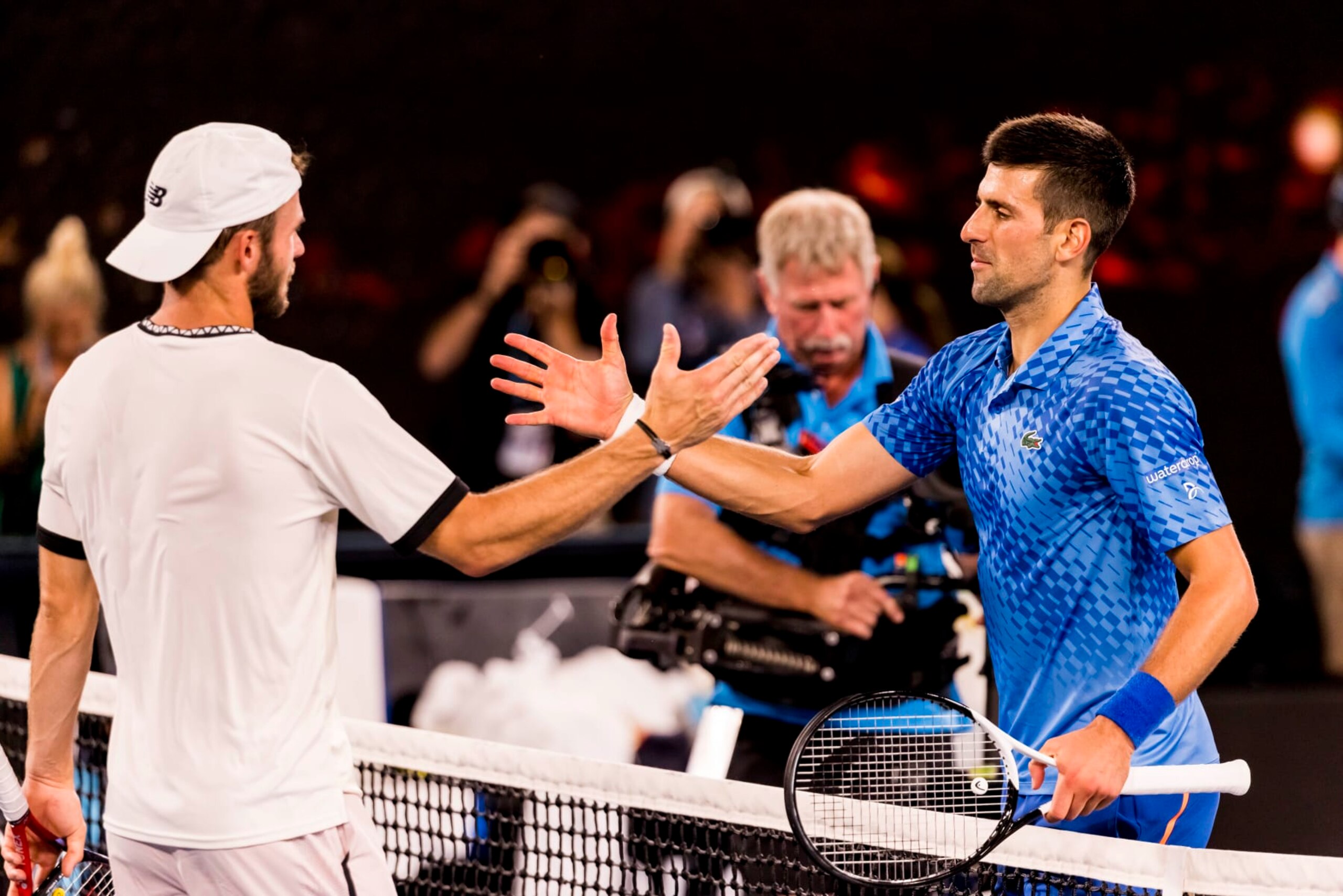 MELBOURNE, VIC - JANUARY 27: Novak Djokovic of Serbia meets his opponent Tommy Paul of the United States of America after winning his Semifinal match of the 2023 Australian Open on January 27 2023, at Melbourne Park in Melbourne, Australia. (Photo by Jason Heidrich/Icon Sportswire via Getty Images)