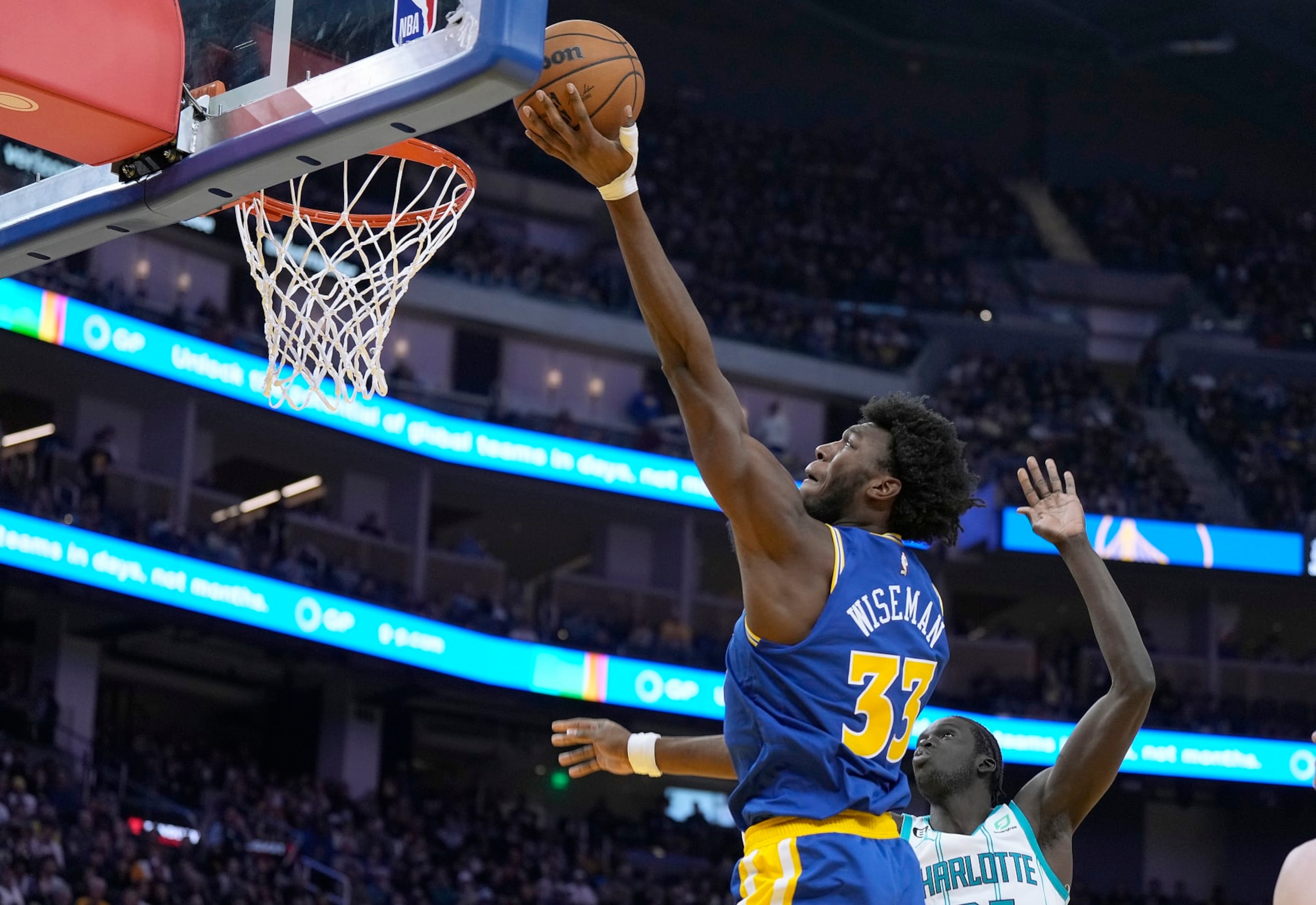 SAN FRANCISCO, CALIFORNIA - DECEMBER 27: James Wiseman #33 of the Golden State Warriors goes in for a layup over JT Thor #21 of the Charlotte Hornets during the third quarter at Chase Center on December 27, 2022 in San Francisco, California. NOTE TO USER: User expressly acknowledges and agrees that, by downloading and or using this photograph, User is consenting to the terms and conditions of the Getty Images License Agreement. (Photo by Thearon W. Henderson/Getty Images) SAN FRANCISCO, CALIFORNIA - DECEMBER 27: James Wiseman #33 of the Golden State Warriors goes in for a layup over JT Thor #21 of the Charlotte Hornets during the third quarter at Chase Center on December 27, 2022 in San Francisco, California. NOTE TO USER: User expressly acknowledges and agrees that, by downloading and or using this photograph, User is consenting to the terms and conditions of the Getty Images License Agreement. (Photo by Thearon W. Henderson/Getty Images)