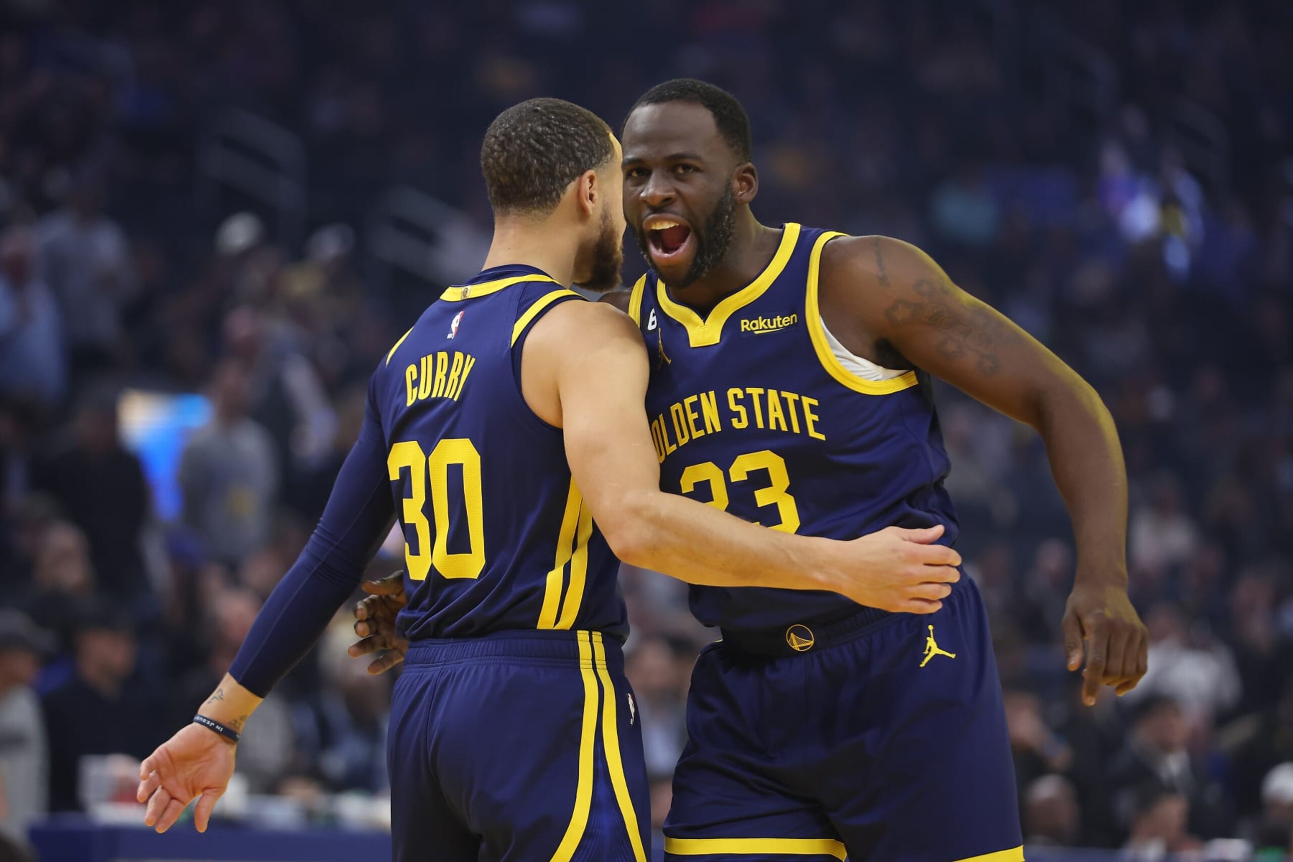 SAN FRANCISCO, CALIFORNIA - JANUARY 25: Stephen Curry #30 hugs Draymond Green #23 of the Golden State Warriors before the game against the Memphis Grizzlies  at Chase Center on January 25, 2023 in San Francisco, California. NOTE TO USER: User expressly acknowledges and agrees that, by downloading and/or using this photograph, User is consenting to the terms and conditions of the Getty Images License Agreement. (Photo by Lachlan Cunningham/Getty Images)