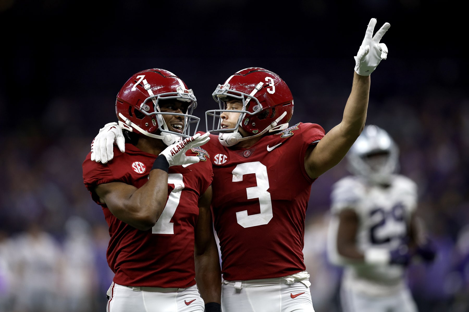 NEW ORLEANS, LOUISIANA - DECEMBER 31: Jordan Battle #9 of the Alabama Crimson Tide reacts with DeMarcco Hellams #2 of the Alabama Crimson Tide after intercepting a pass against the Kansas State Wildcats during the first quarter of the Allstate Sugar Bowl at Caesars Superdome on December 31, 2022 in New Orleans, Louisiana. (Photo by Sean Gardner/Getty Images)