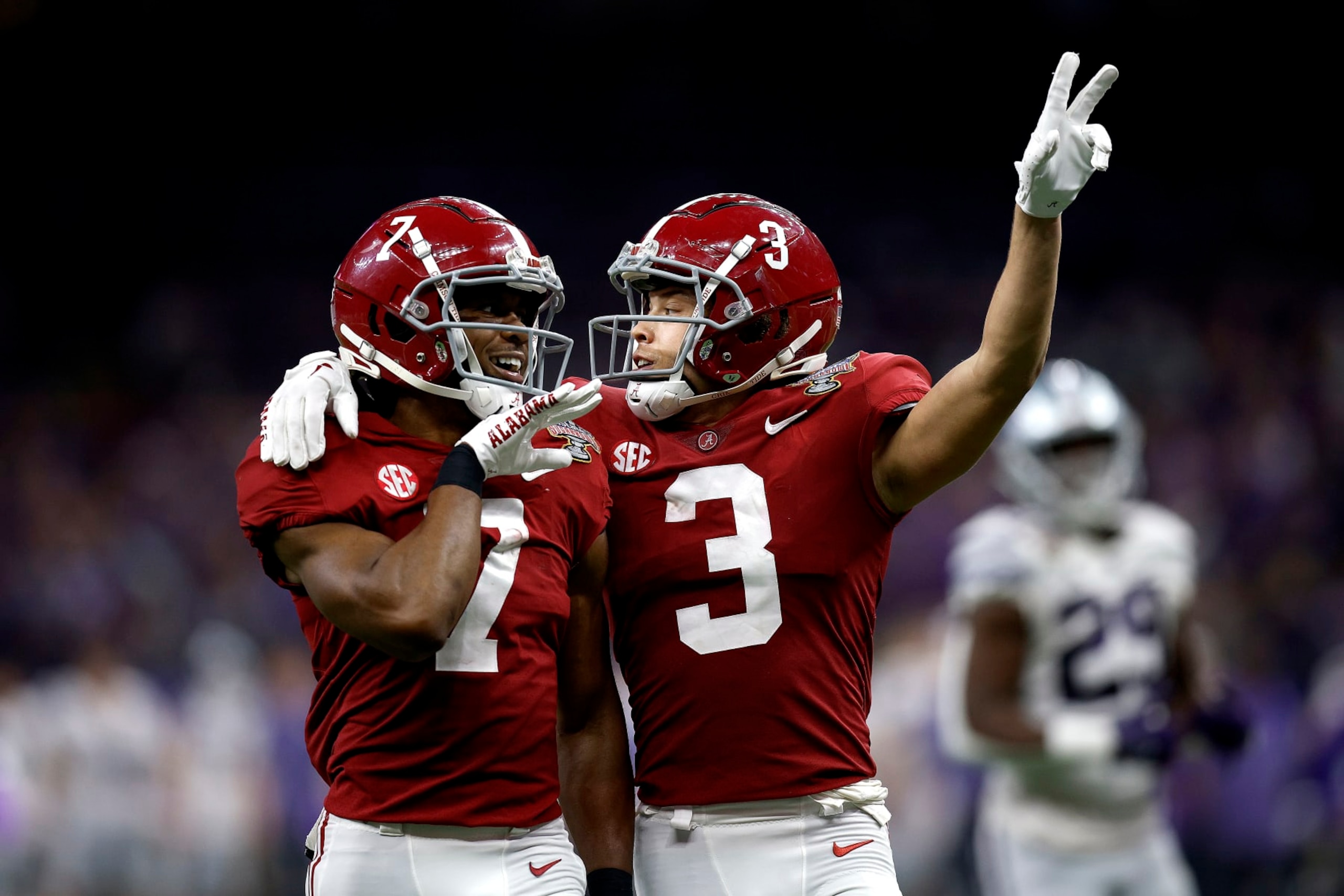 NEW ORLEANS, LOUISIANA - DECEMBER 31: Jordan Battle #9 of the Alabama Crimson Tide reacts with DeMarcco Hellams #2 of the Alabama Crimson Tide after intercepting a pass against the Kansas State Wildcats during the first quarter of the Allstate Sugar Bowl at Caesars Superdome on December 31, 2022 in New Orleans, Louisiana. (Photo by Sean Gardner/Getty Images)