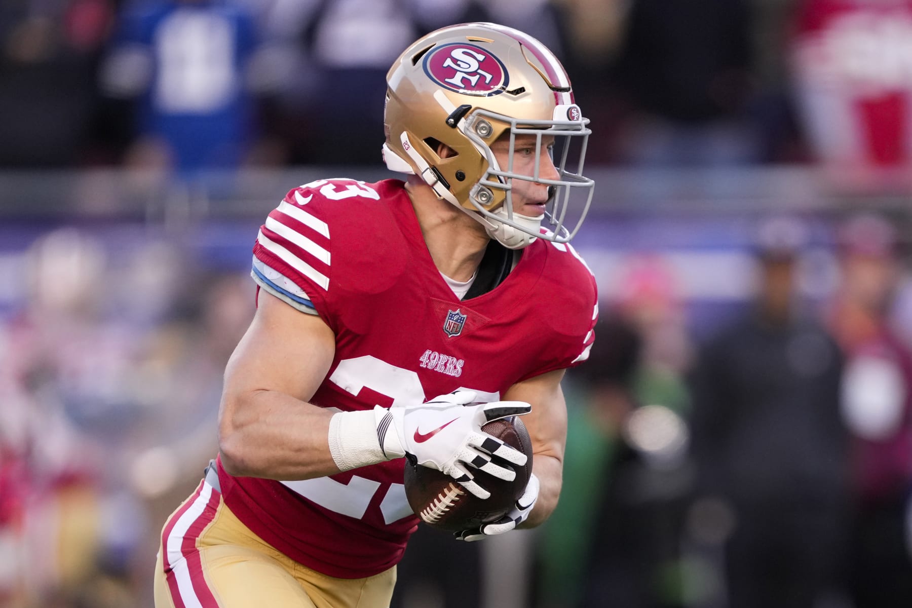 SANTA CLARA, CALIFORNIA - JANUARY 22: Christian McCaffrey #23 of the San Francisco 49ers carries the ball against the Dallas Cowboys during the first quarter in the NFC Divisional Playoff game at Levi's Stadium on January 22, 2023 in Santa Clara, California. (Photo by Thearon W. Henderson/Getty Images)