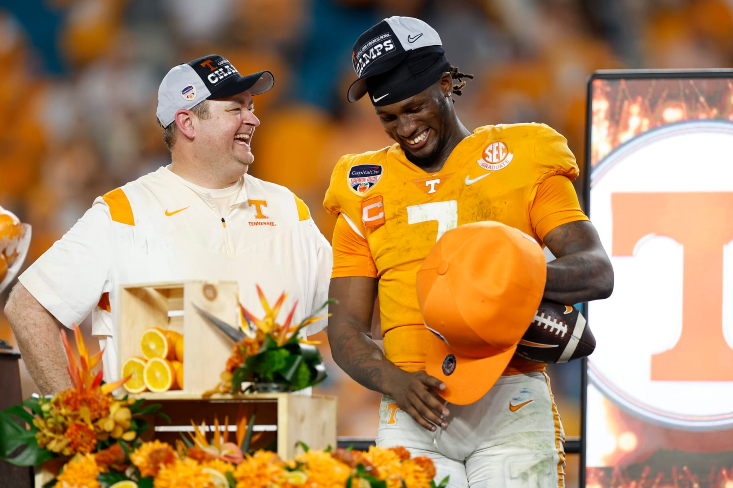 MIAMI GARDENS, FL - DECEMBER 30: Tennessee Volunteers quarterback Joe Milton III (7) and Tennessee Volunteers head coach Josh Heupel share a laugh after the Capital One Orange Bowl between the Tennessee Volunteers and the Clemson Tigers on December 30, 2022 at Hard Rock Stadium in Miami Gardens, Fl. (Photo by David Rosenblum/Icon Sportswire via Getty Images)