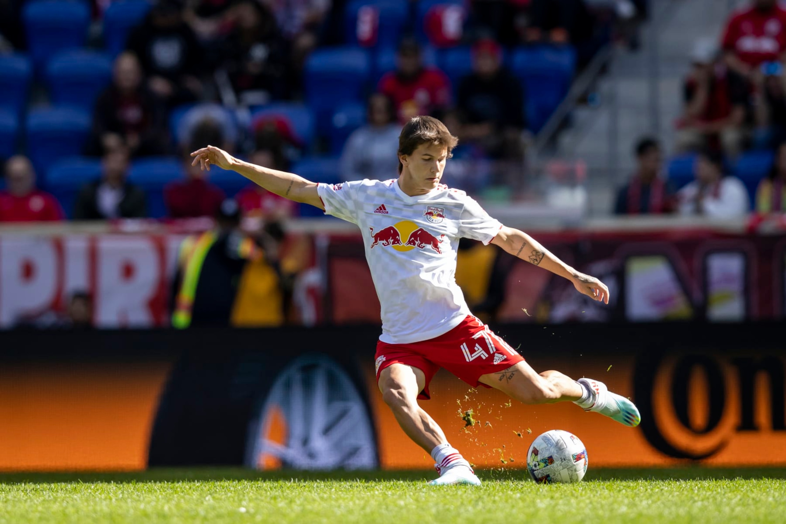 HARRISON, NJ - OCTOBER 15: John Tolkin #47 of New York Red Bulls passes the ball in the second half of the Eastern Conference Round One match in the Audi 2022 MLS Cup Playoff against FC Cincinnati at Red Bull Arena on October 15, 2022 in Harrison, New Jersey. (Photo by Ira L. Black - Corbis/Getty Images)