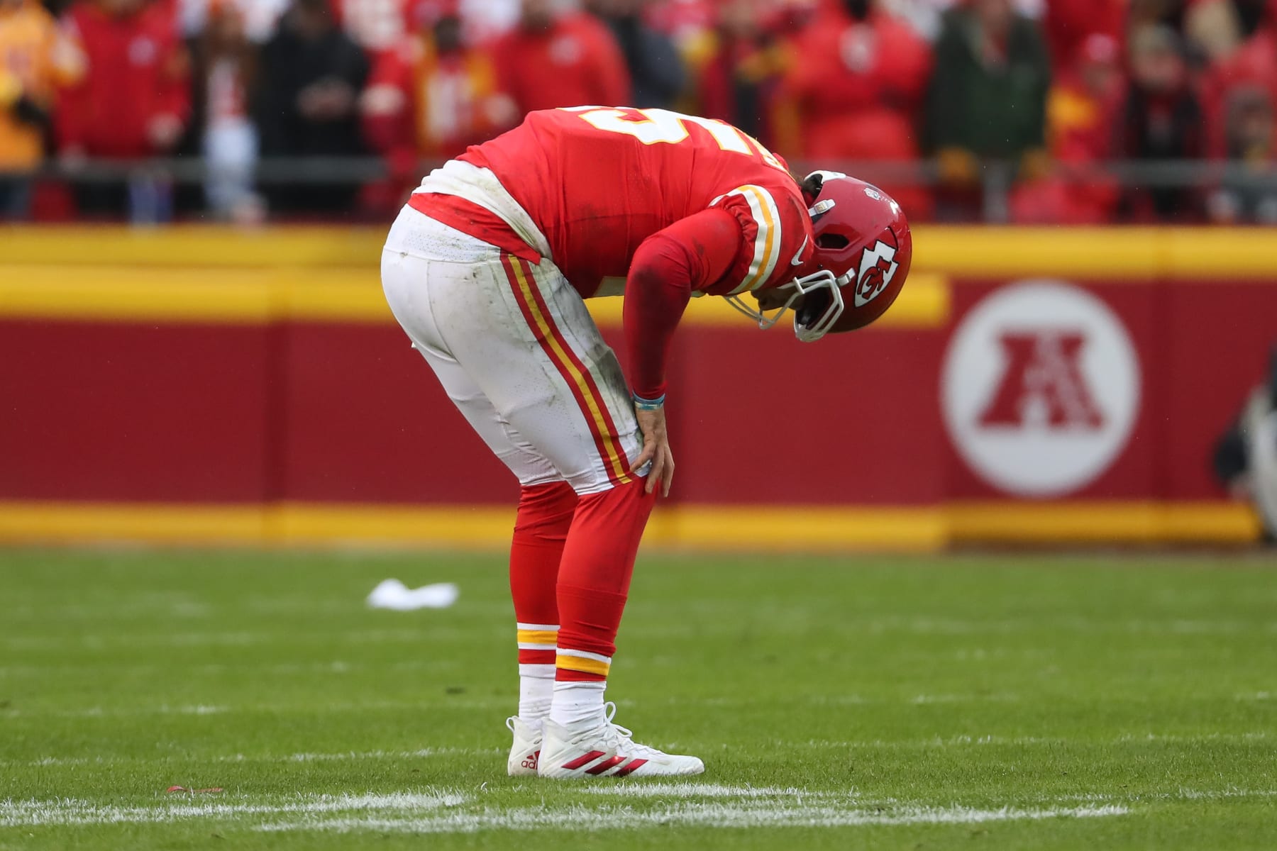 KANSAS CITY, MO - JANUARY 21: Kansas City Chiefs quarterback Patrick Mahomes (15) crouches in pain in the first quarter of an AFC divisional playoff game between the Jacksonville Jaguars and Kansas City Chiefs on January 21, 2023 at GEHA Field at Arrowhead Stadium in Kansas City, MO. (Photo by Scott Winters/Icon Sportswire via Getty Images)
