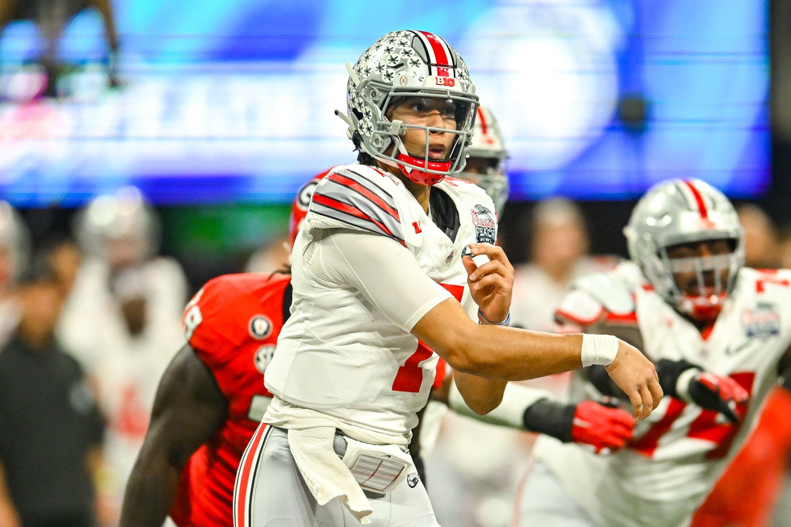 ATLANTA, GA  DECEMBER 31:  Ohio State quarterback C.J. Stroud (7) drops back to pass during the Chick-fil-A Peach Bowl college football playoff game between the Ohio State Buckeyes and the Georgia Bulldogs on December 31st, 2022 at Mercedes-Benz Stadium in Atlanta, GA.  (Photo by Rich von Biberstein/Icon Sportswire via Getty Images)