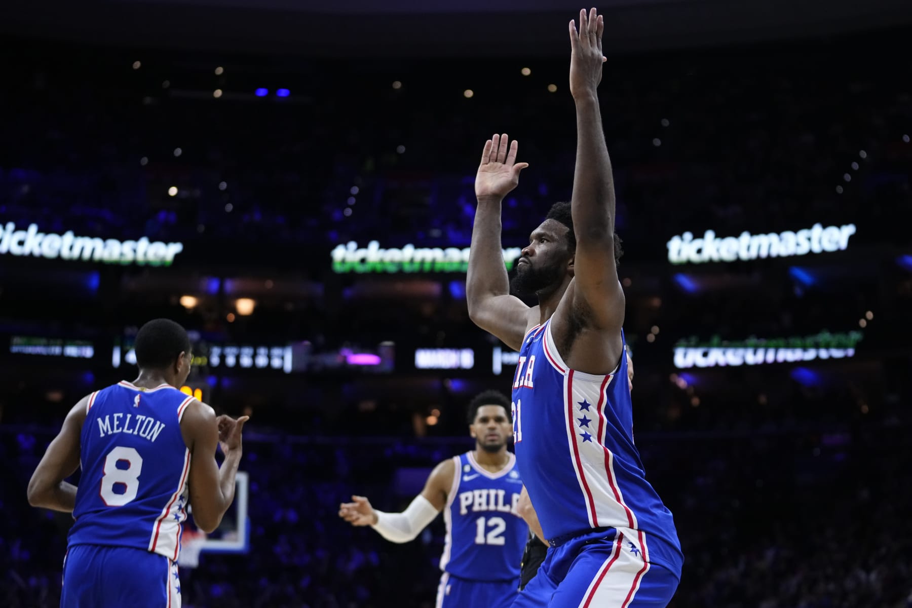 Philadelphia 76ers' Joel Embiid, right, reacts after making a basket during the second half of an NBA basketball game against the Brooklyn Nets, Wednesday, Jan. 25, 2023, in Philadelphia. (AP Photo/Matt Slocum)