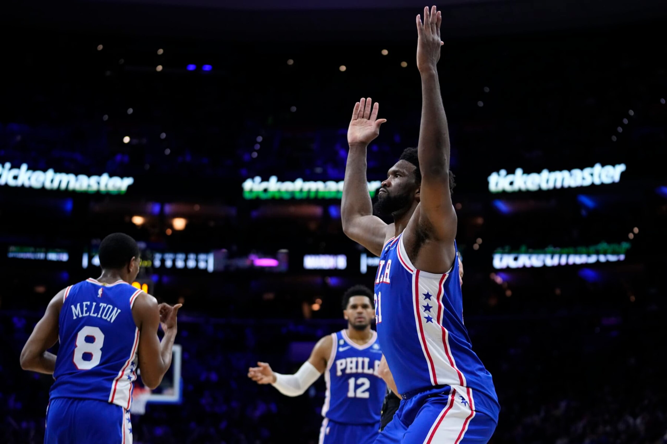 Philadelphia 76ers' Joel Embiid, right, reacts after making a basket during the second half of an NBA basketball game against the Brooklyn Nets, Wednesday, Jan. 25, 2023, in Philadelphia. (AP Photo/Matt Slocum)