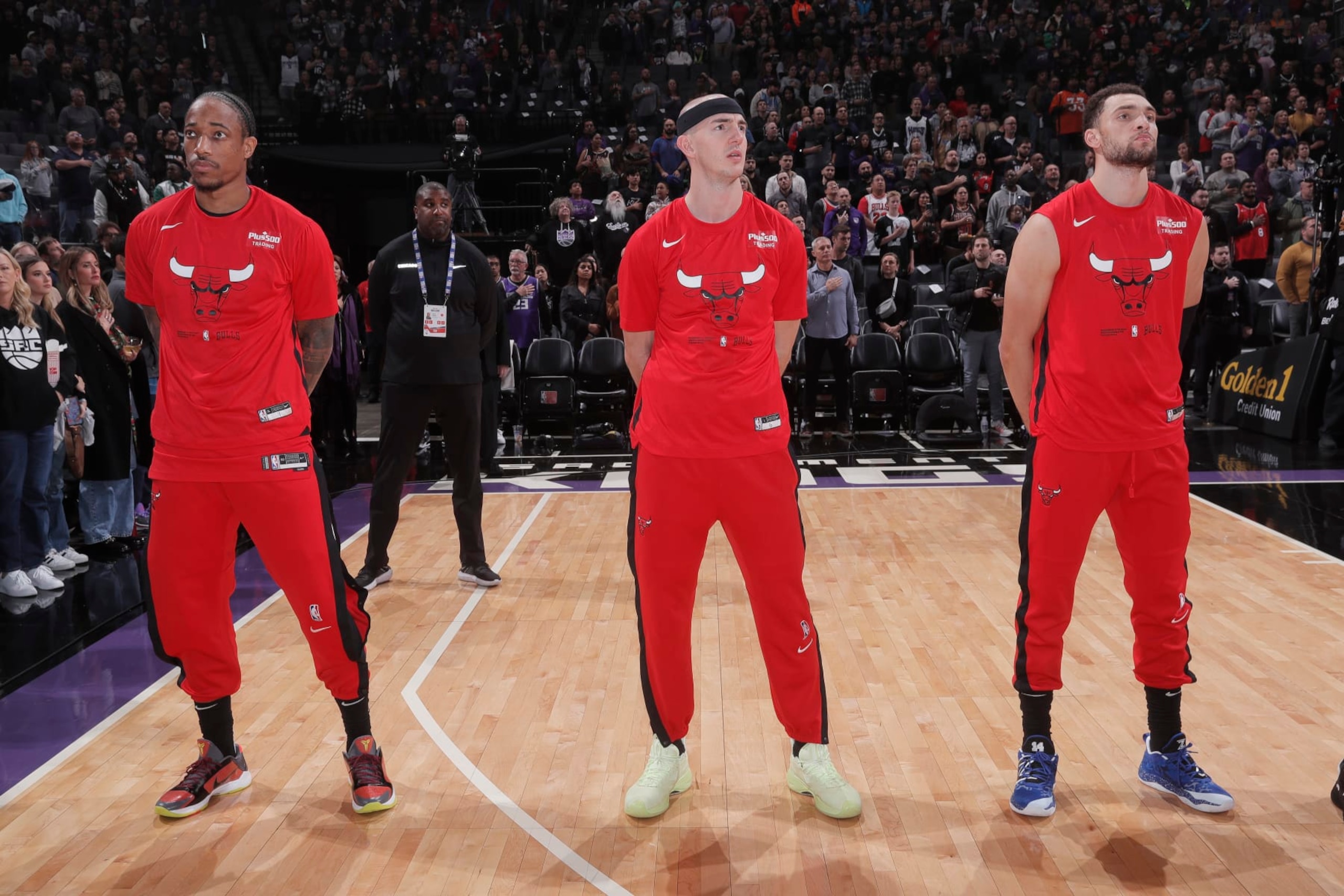 SACRAMENTO, CA - DECEMBER 4: DeMar DeRozan #11, Alex Caruso #6, and Zach LaVine #8 of the Chicago Bulls stand for the National Anthem prior to the game against the Sacramento Kings on December 4, 2022 at Golden 1 Center in Sacramento, California. NOTE TO USER: User expressly acknowledges and agrees that, by downloading and or using this photograph, User is consenting to the terms and conditions of the Getty Images Agreement. Mandatory Copyright Notice: Copyright 2022 NBAE (Photo by Rocky Widner/NBAE via Getty Images)