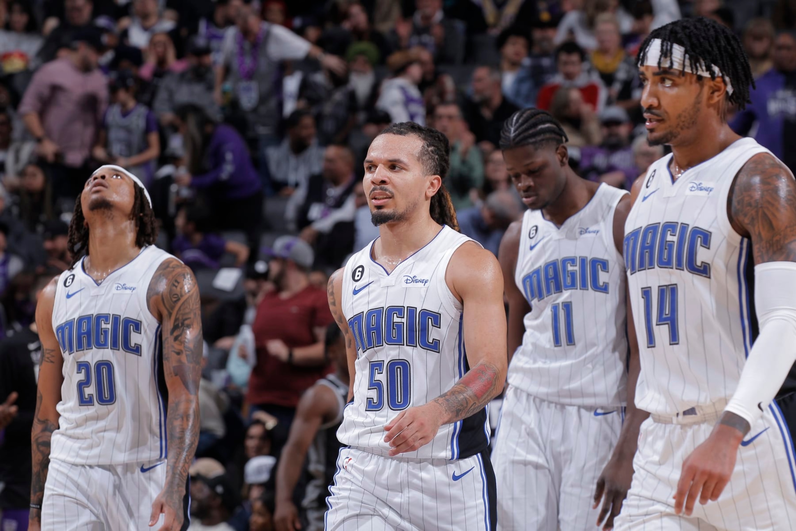 SACRAMENTO, CA - JANUARY 9: Markelle Fultz #20, Cole Anthony #50, Mo Bamba #11, and Gary Harris #14 of the Orlando Magic walk to the bench during a timeout in a game against the Sacramento Kings on January 9, 2023 at Golden 1 Center in Sacramento, California. NOTE TO USER: User expressly acknowledges and agrees that, by downloading and or using this photograph, User is consenting to the terms and conditions of the Getty Images Agreement. Mandatory Copyright Notice: Copyright 2023 NBAE (Photo by Rocky Widner/NBAE via Getty Images)