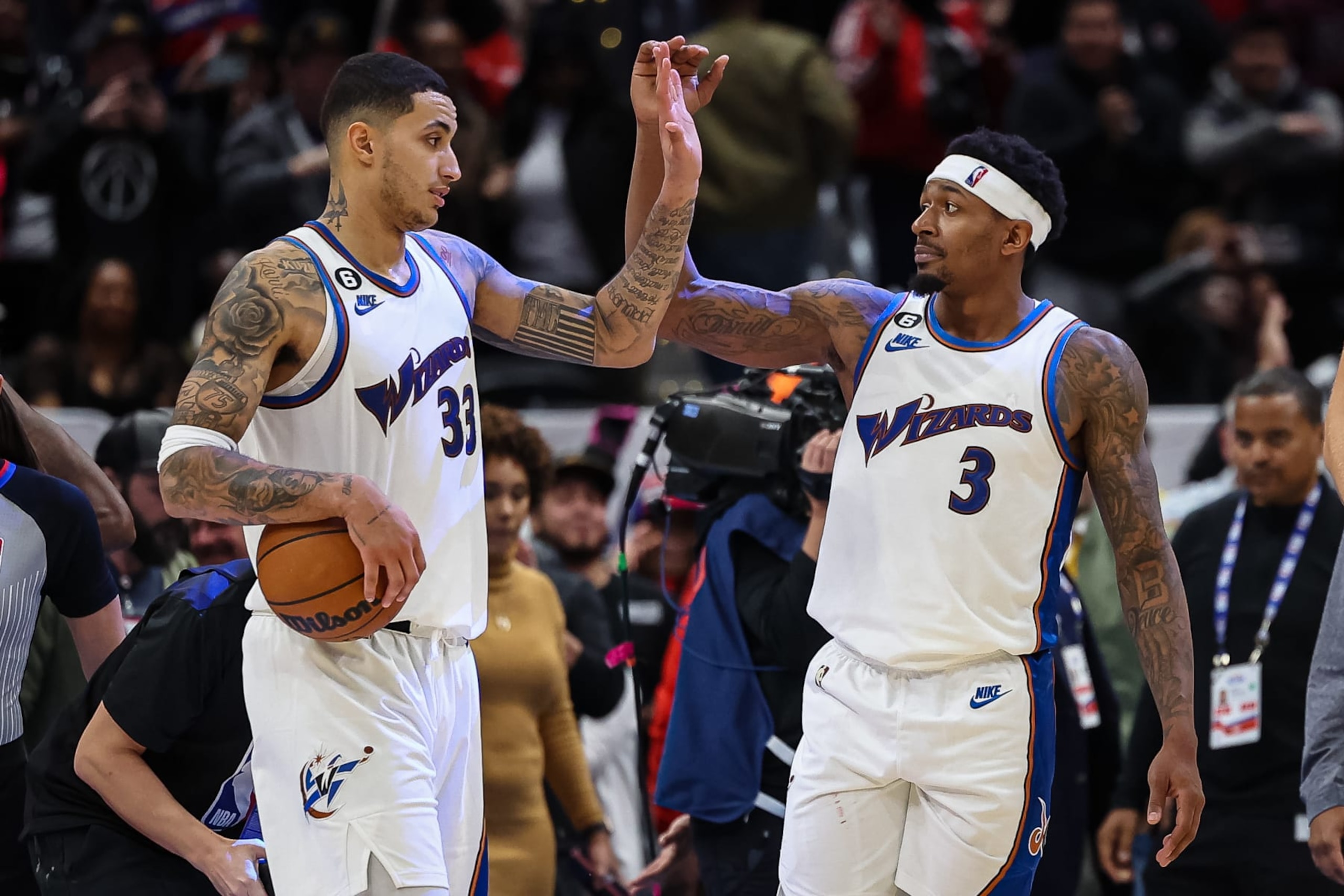 WASHINGTON, DC - NOVEMBER 18: Kyle Kuzma #33 of the Washington Wizards and Bradley Beal #3 celebrate after overtime against the Miami Heat at Capital One Arena on November 18, 2022 in Washington, DC. NOTE TO USER: User expressly acknowledges and agrees that, by downloading and or using this photograph, User is consenting to the terms and conditions of the Getty Images License Agreement. (Photo by Scott Taetsch/Getty Images)