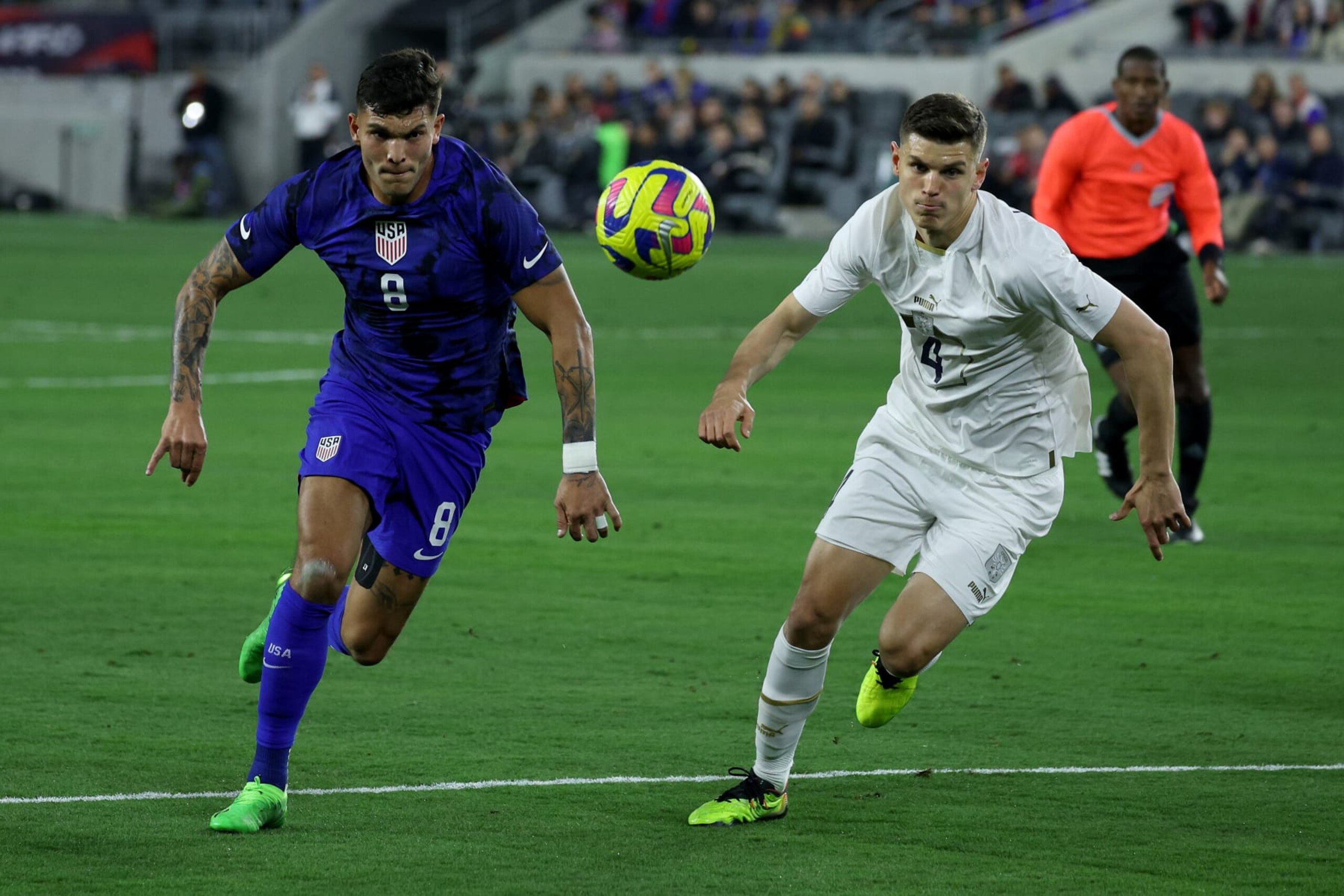 LOS ANGELES, CALIFORNIA - JANUARY 25: Brandon Vazquez #8 of the United States chases after the ball against Ranko Vesellnovic #4 of Serbia during the first half in the International Friendly match at BMO Stadium on January 25, 2023 in Los Angeles, California. (Photo by Harry How/Getty Images)
