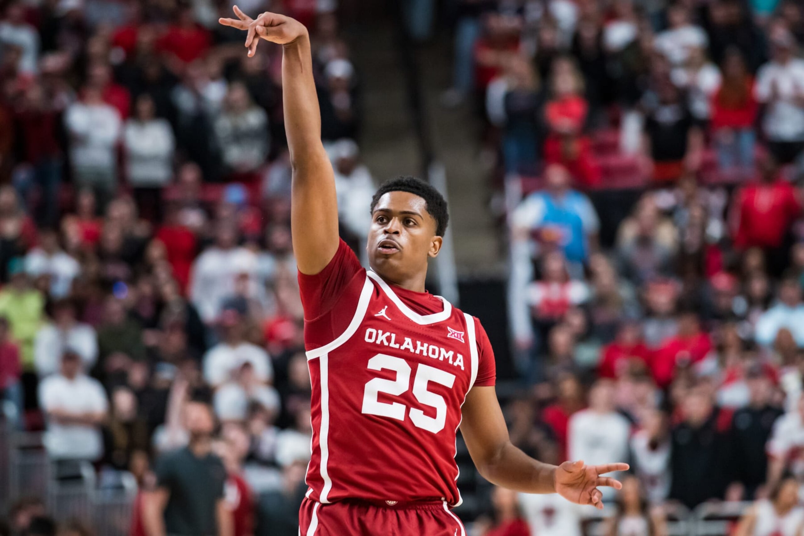 LUBBOCK, TEXAS - JANUARY 07: Guard Grant Sherfield #25 of the Oklahoma Sooners shoots the ball during the first half of the college basketball game against the Texas Tech Red Raiders at United Supermarkets Arena on January 07, 2023 in Lubbock, Texas. (Photo by John E. Moore III/Getty Images) LUBBOCK, TEXAS - JANUARY 07: Guard Grant Sherfield #25 of the Oklahoma Sooners shoots the ball during the first half of the college basketball game against the Texas Tech Red Raiders at United Supermarkets Arena on January 07, 2023 in Lubbock, Texas. (Photo by John E. Moore III/Getty Images)