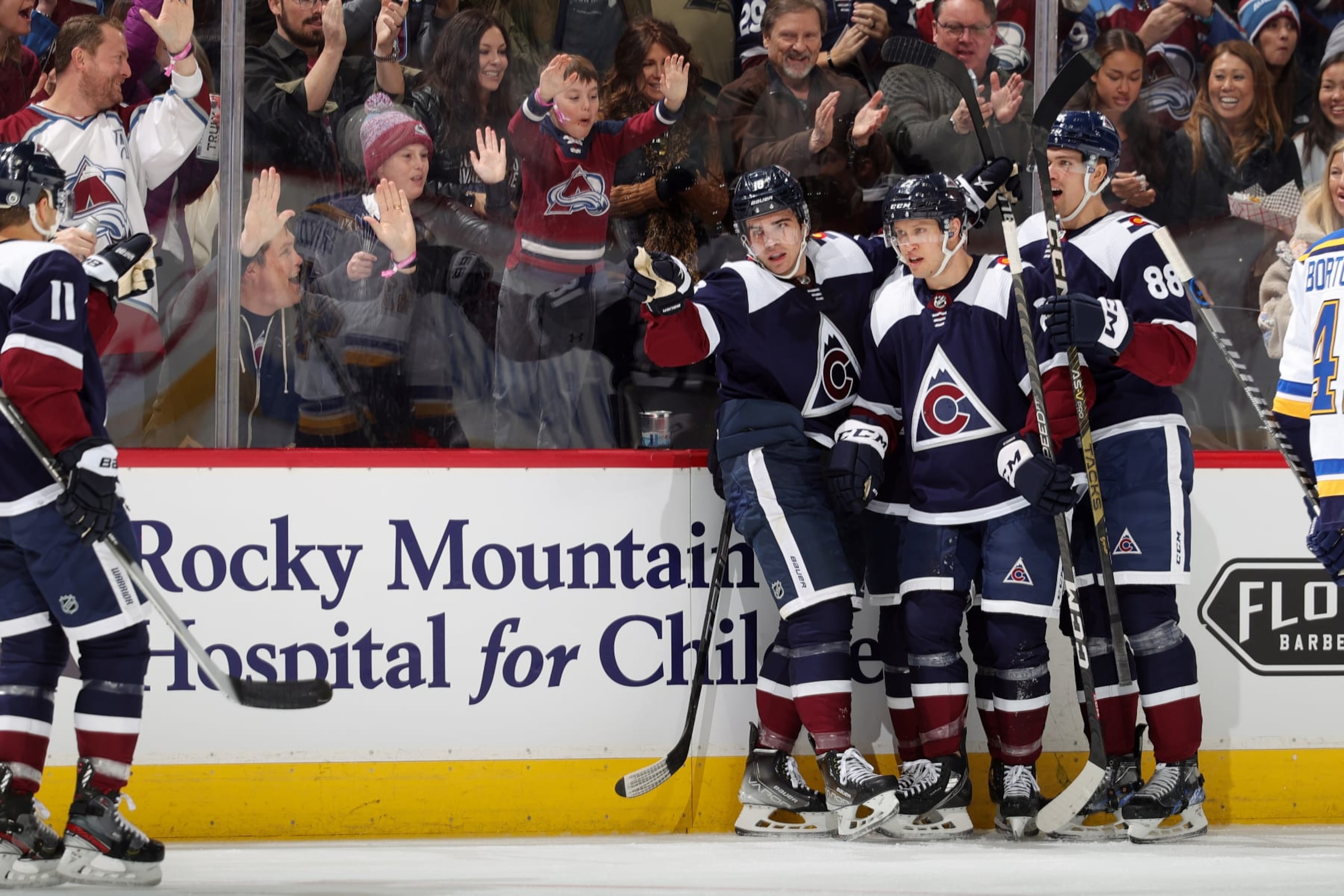 DENVER, COLORADO - JANUARY 28: Andrew Cogliano #11, Alex Newhook #18, Logan O'Connor #25 and Andreas Englund #88 of the Colorado Avalanche celebrate a goal against the St. Louis Blues at Ball Arena on January 28, 2023 in Denver, Colorado. (Photo by Michael Martin/NHLI via Getty Images)