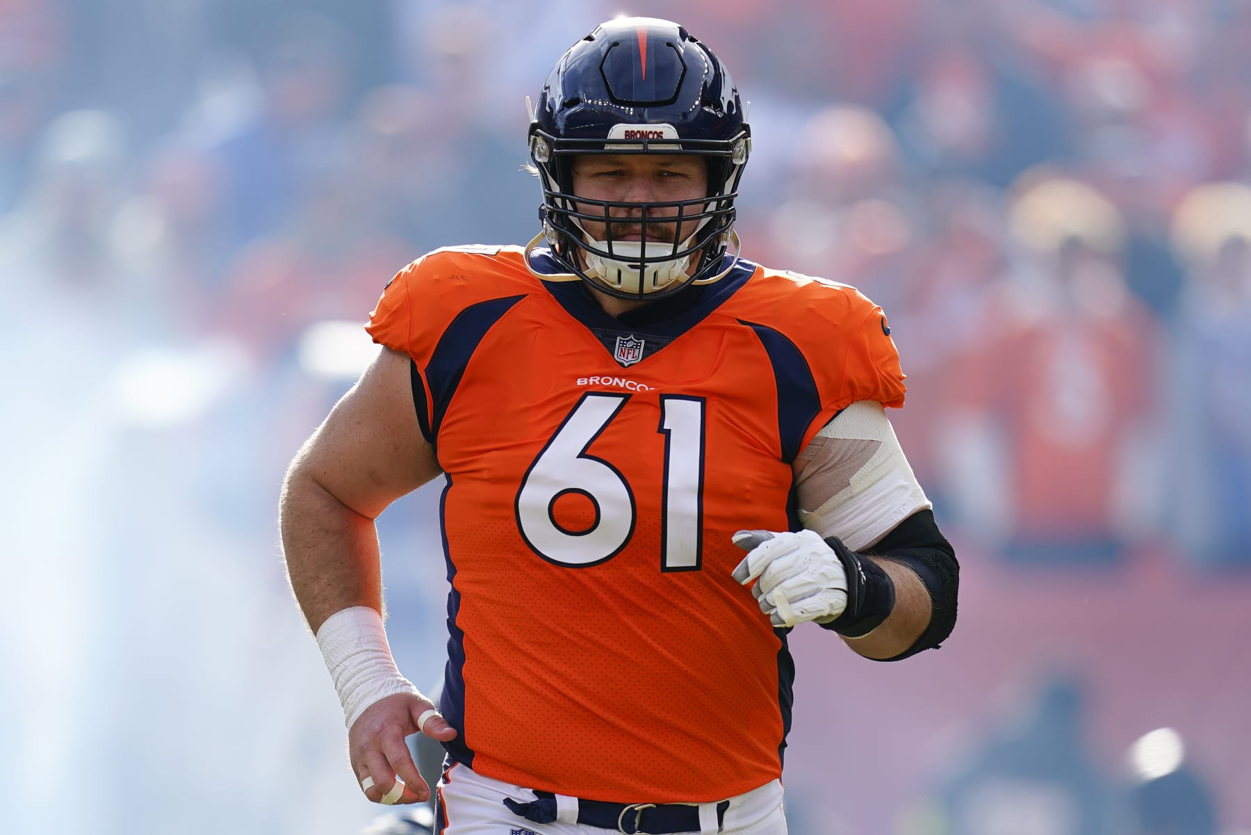 Denver Broncos guard Graham Glasgow (61) takes the field for player introductions against the Arizona Cardinals during an NFL football game Sunday, Dec. 18, 2022, in Denver. (AP Photo/Jack Dempsey)