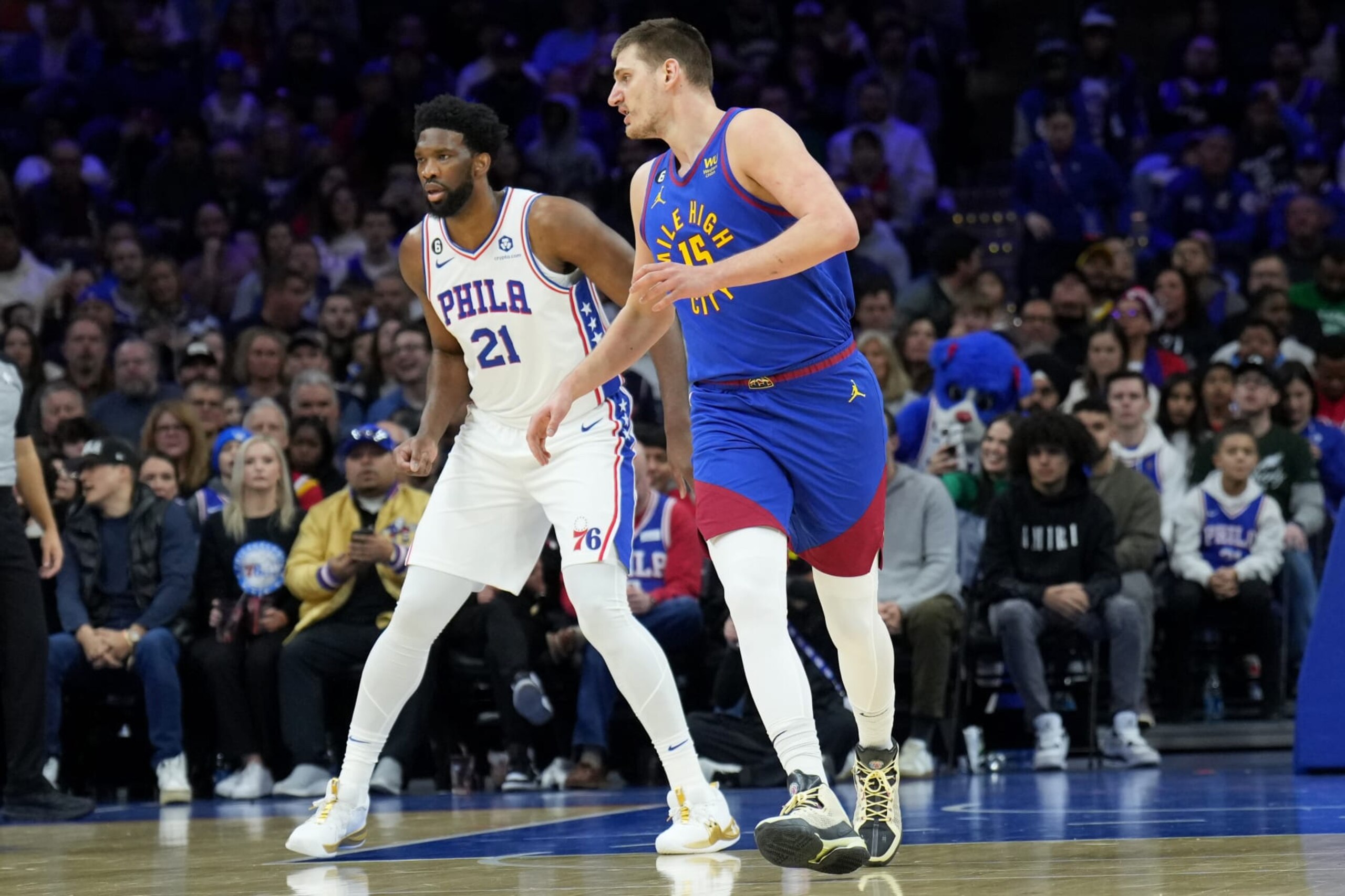 PHILADELPHIA, PA - JANUARY 28: Joel Embiid #21 of the Philadelphia 76ers and Nikola Jokic #15 of the Denver Nuggets look on during the game on January 28, 2023 at the Wells Fargo Center in Philadelphia, Pennsylvania NOTE TO USER: User expressly acknowledges and agrees that, by downloading and/or using this Photograph, user is consenting to the terms and conditions of the Getty Images License Agreement. Mandatory Copyright Notice: Copyright 2023 NBAE (Photo by Jesse D. Garrabrant/NBAE via Getty Images) PHILADELPHIA, PA - JANUARY 28: Joel Embiid #21 of the Philadelphia 76ers and Nikola Jokic #15 of the Denver Nuggets look on during the game on January 28, 2023 at the Wells Fargo Center in Philadelphia, Pennsylvania NOTE TO USER: User expressly acknowledges and agrees that, by downloading and/or using this Photograph, user is consenting to the terms and conditions of the Getty Images License Agreement. Mandatory Copyright Notice: Copyright 2023 NBAE (Photo by Jesse D. Garrabrant/NBAE via Getty Images)