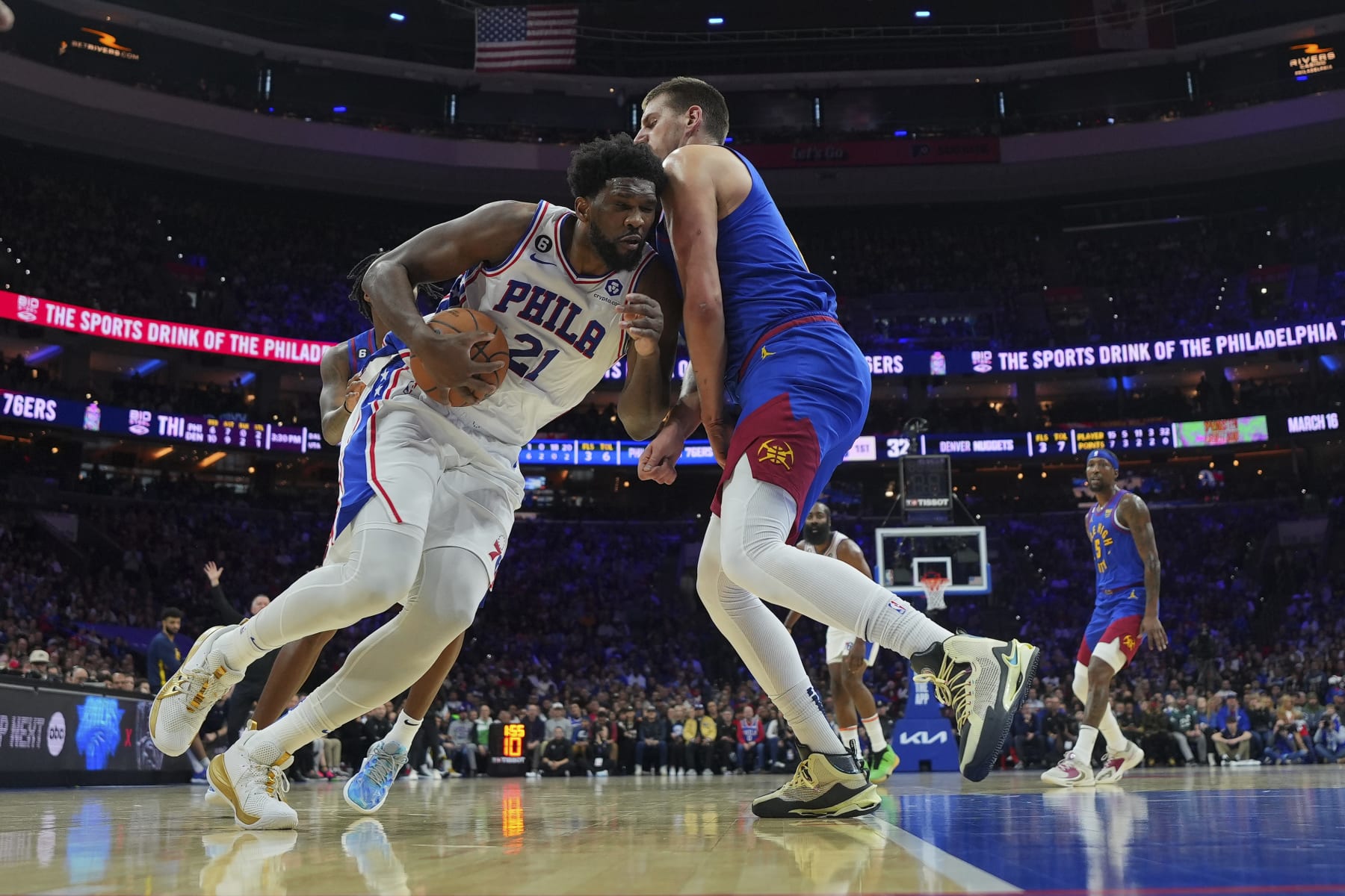 PHILADELPHIA, PA - JANUARY 28: Joel Embiid #21 of the Philadelphia 76ers drives to the basket against Nikola Jokic #15 of the Denver Nuggets in the first quarter of the game at the Wells Fargo Center on January 28, 2023 in Philadelphia, Pennsylvania.  NOTE TO USER: User expressly acknowledges and agrees that, by downloading and or using this photograph, User is consenting to the terms and conditions of the Getty Images License Agreement. (Photo by Mitchell Leff/Getty Images)