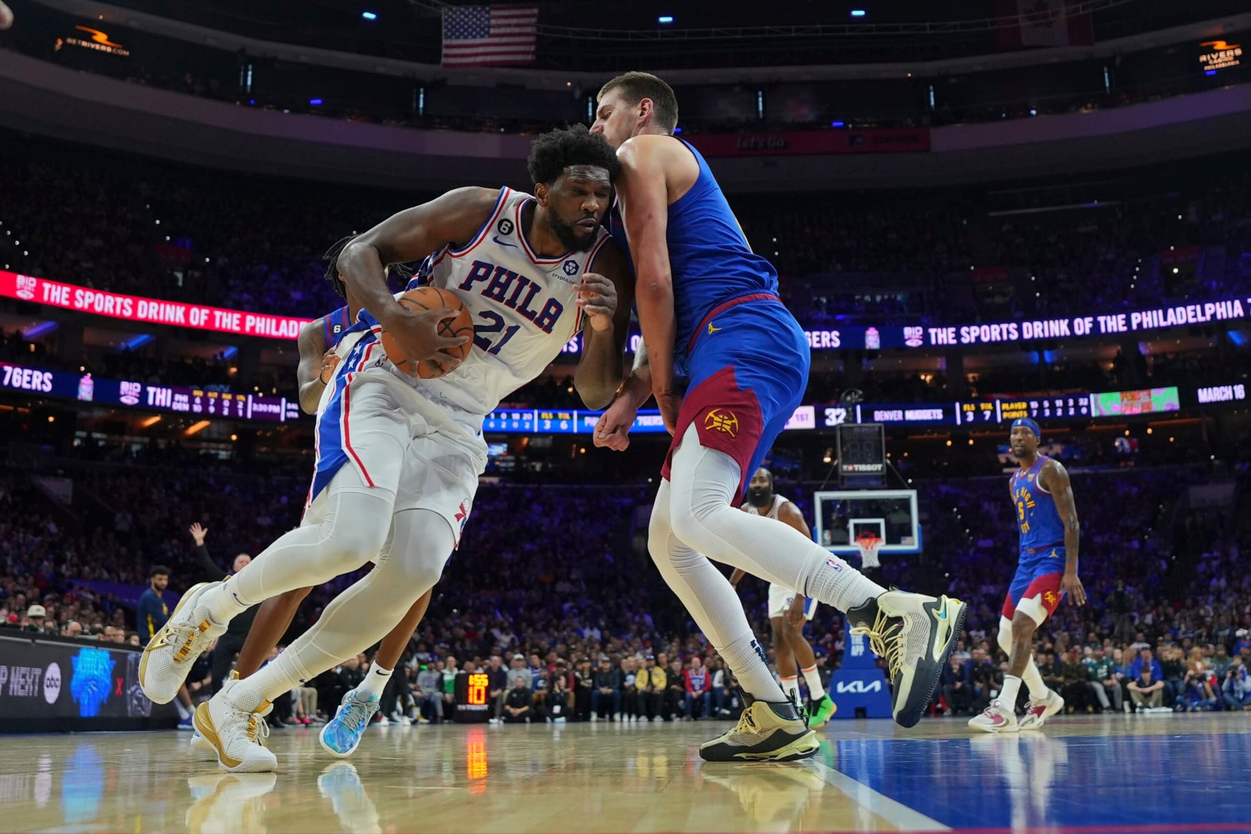 PHILADELPHIA, PA - JANUARY 28: Joel Embiid #21 of the Philadelphia 76ers drives to the basket against Nikola Jokic #15 of the Denver Nuggets in the first quarter of the game at the Wells Fargo Center on January 28, 2023 in Philadelphia, Pennsylvania.  NOTE TO USER: User expressly acknowledges and agrees that, by downloading and or using this photograph, User is consenting to the terms and conditions of the Getty Images License Agreement. (Photo by Mitchell Leff/Getty Images)