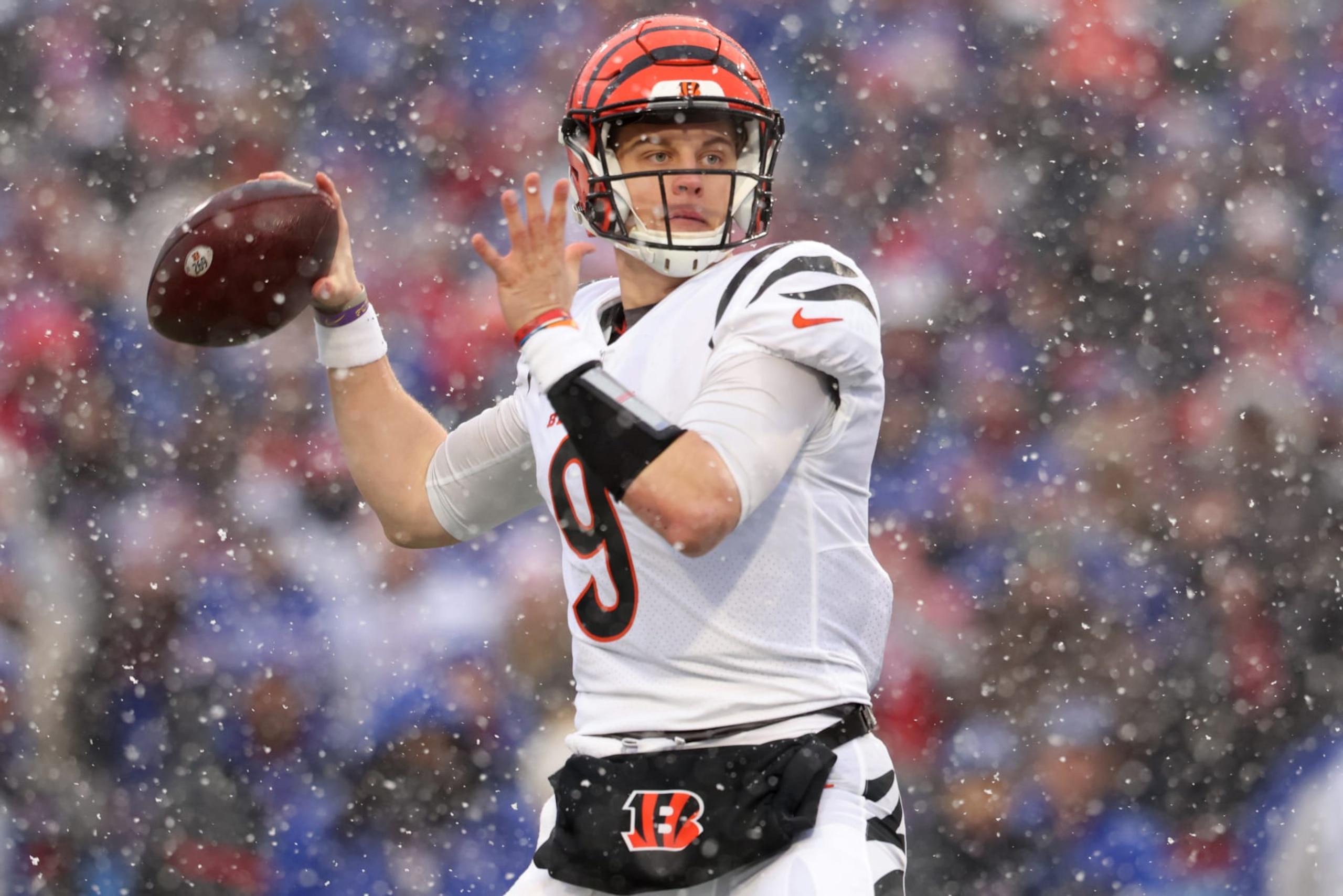 ORCHARD PARK, NEW YORK - JANUARY 22: Joe Burrow #9 of the Cincinnati Bengals looks to throw a pass against the Buffalo Bills during the first quarter in the AFC Divisional Playoff game at Highmark Stadium on January 22, 2023 in Orchard Park, New York. (Photo by Bryan M. Bennett/Getty Images)