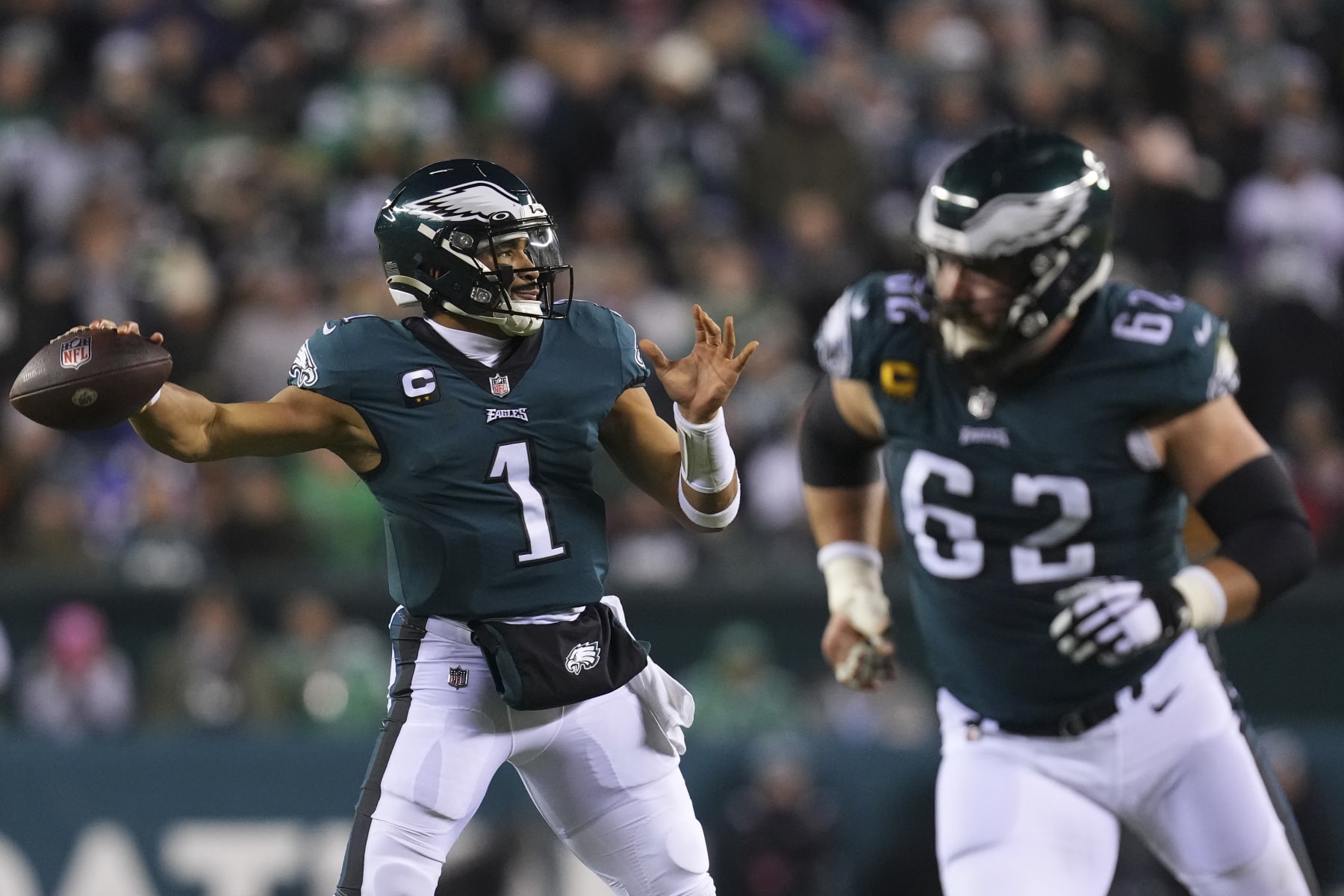 PHILADELPHIA, PA - JANUARY 21: Jalen Hurts #1 of the Philadelphia Eagles passes the ball as Jason Kelce #62 blocks against the New York Giants during the NFC Divisional Playoff game at Lincoln Financial Field on January 21, 2023 in Philadelphia, Pennsylvania. (Photo by Mitchell Leff/Getty Images)