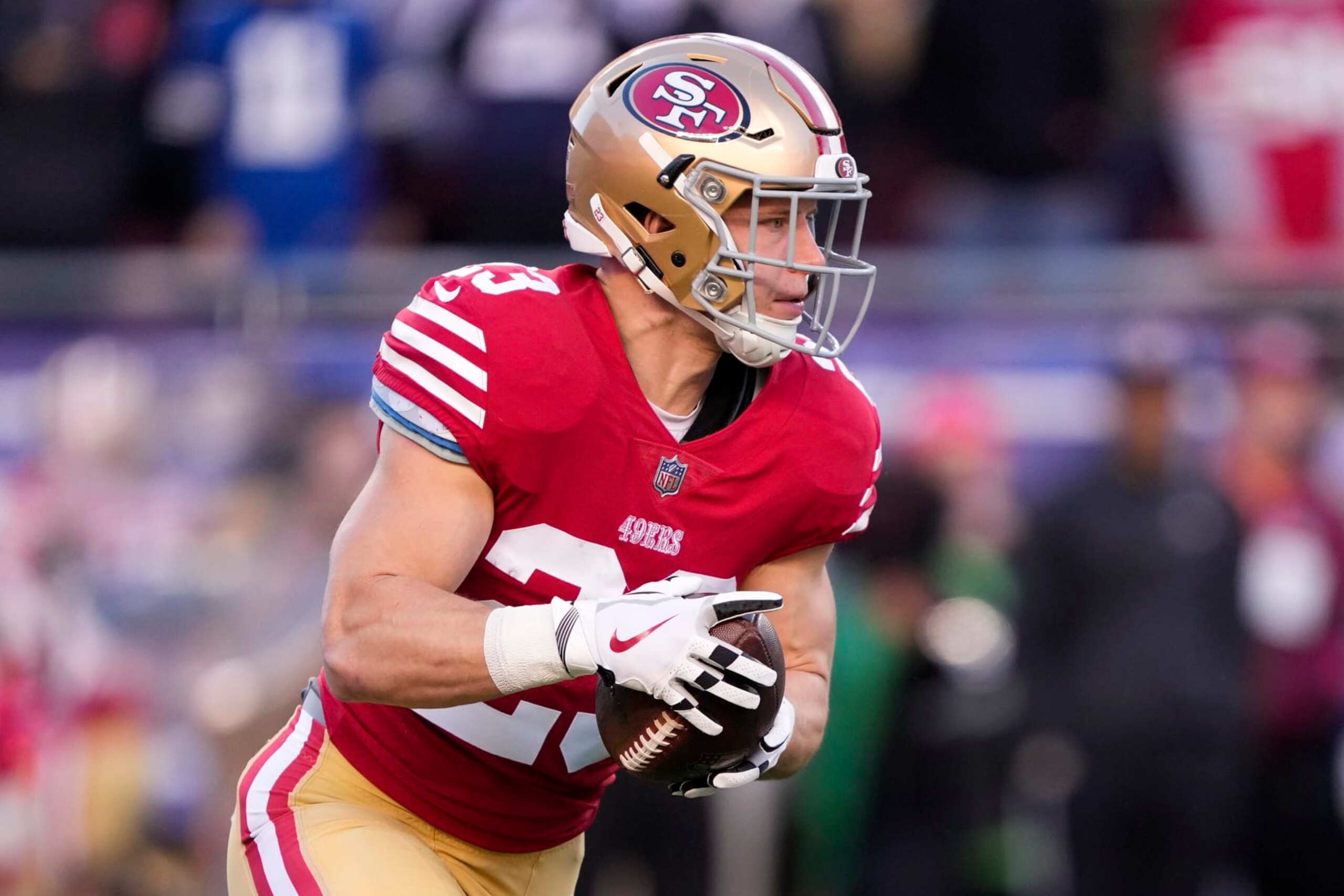 SANTA CLARA, CALIFORNIA - JANUARY 22: Christian McCaffrey #23 of the San Francisco 49ers carries the ball against the Dallas Cowboys during the first quarter in the NFC Divisional Playoff game at Levi's Stadium on January 22, 2023 in Santa Clara, California. (Photo by Thearon W. Henderson/Getty Images)