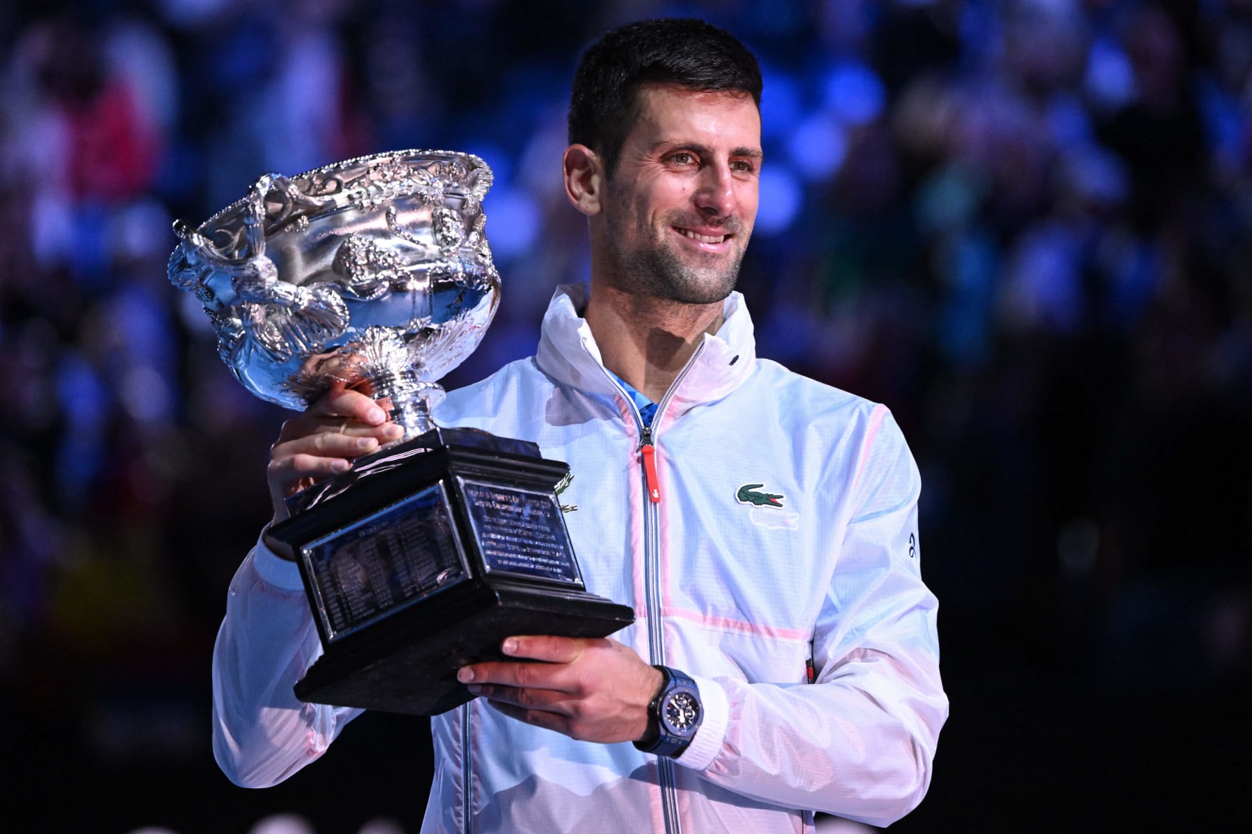 Serbia's Novak Djokovic poses with the Norman Brookes Challenge Cup after his victory against Greece's Stefanos Tsitsipas during the men's singles final on day fourteen of the Australian Open tennis tournament in Melbourne on January 29, 2023. - -- IMAGE RESTRICTED TO EDITORIAL USE - STRICTLY NO COMMERCIAL USE -- (Photo by WILLIAM WEST / AFP) / -- IMAGE RESTRICTED TO EDITORIAL USE - STRICTLY NO COMMERCIAL USE -- (Photo by WILLIAM WEST/AFP via Getty Images)