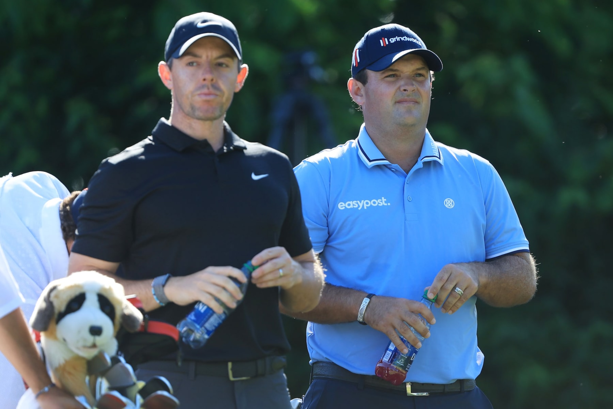 DUBLIN, OHIO - JUNE 03: Rory McIlroy of Northern Ireland and  Patrick Reed of the United States look on from the 15th tree during the second round of the Memorial Tournament presented by Workday at Muirfield Village Golf Club on June 03, 2022 in Dublin, Ohio. (Photo by Sam Greenwood/Getty Images)