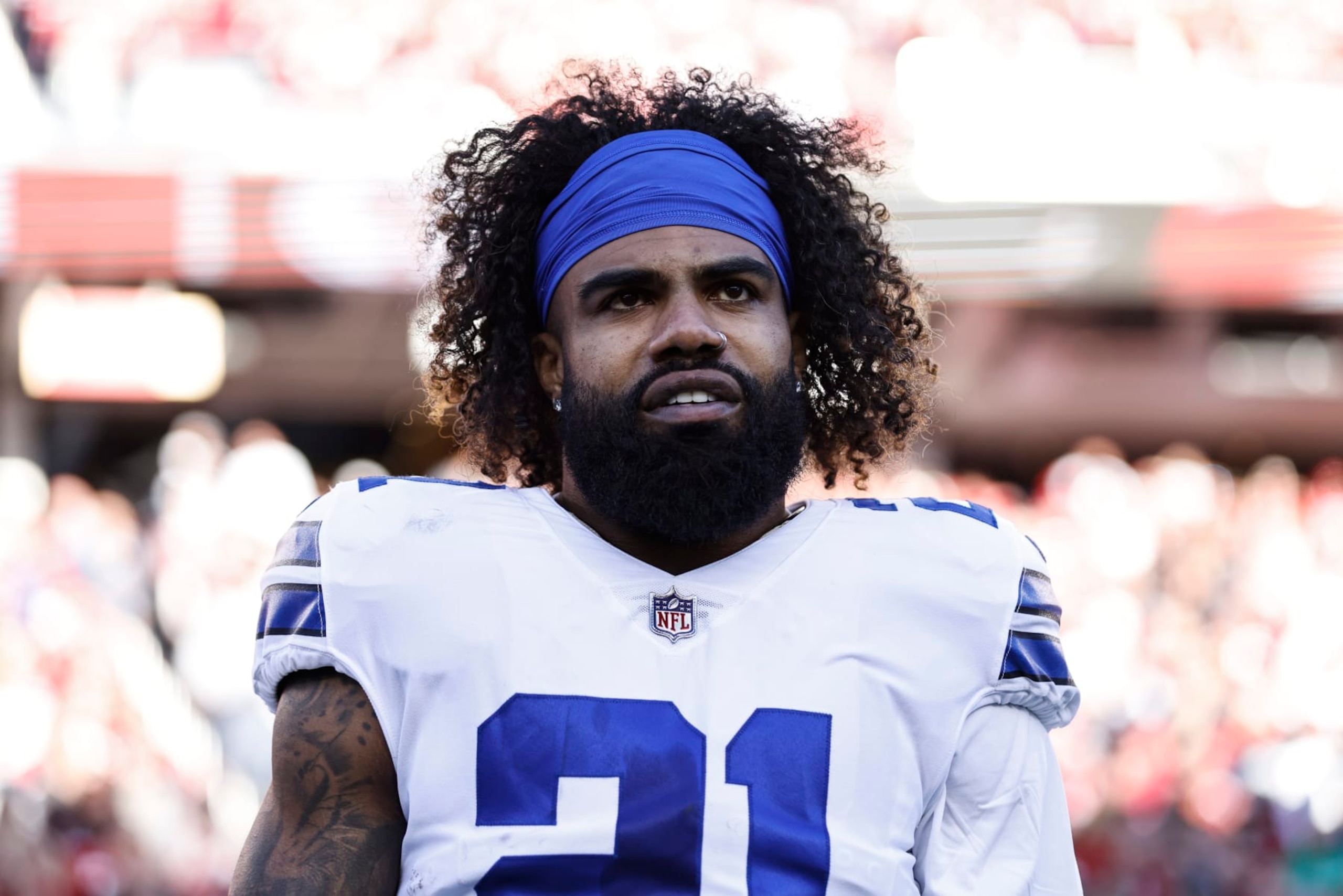SANTA CLARA, CALIFORNIA - JANUARY 22: Ezekiel Elliott #21 of the Dallas Cowboys looks on during the national anthem prior to an NFL divisional round playoff football game between the San Francisco 49ers and the Dallas Cowboys at Levi's Stadium on January 22, 2023 in Santa Clara, California. (Photo by Michael Owens/Getty Images)