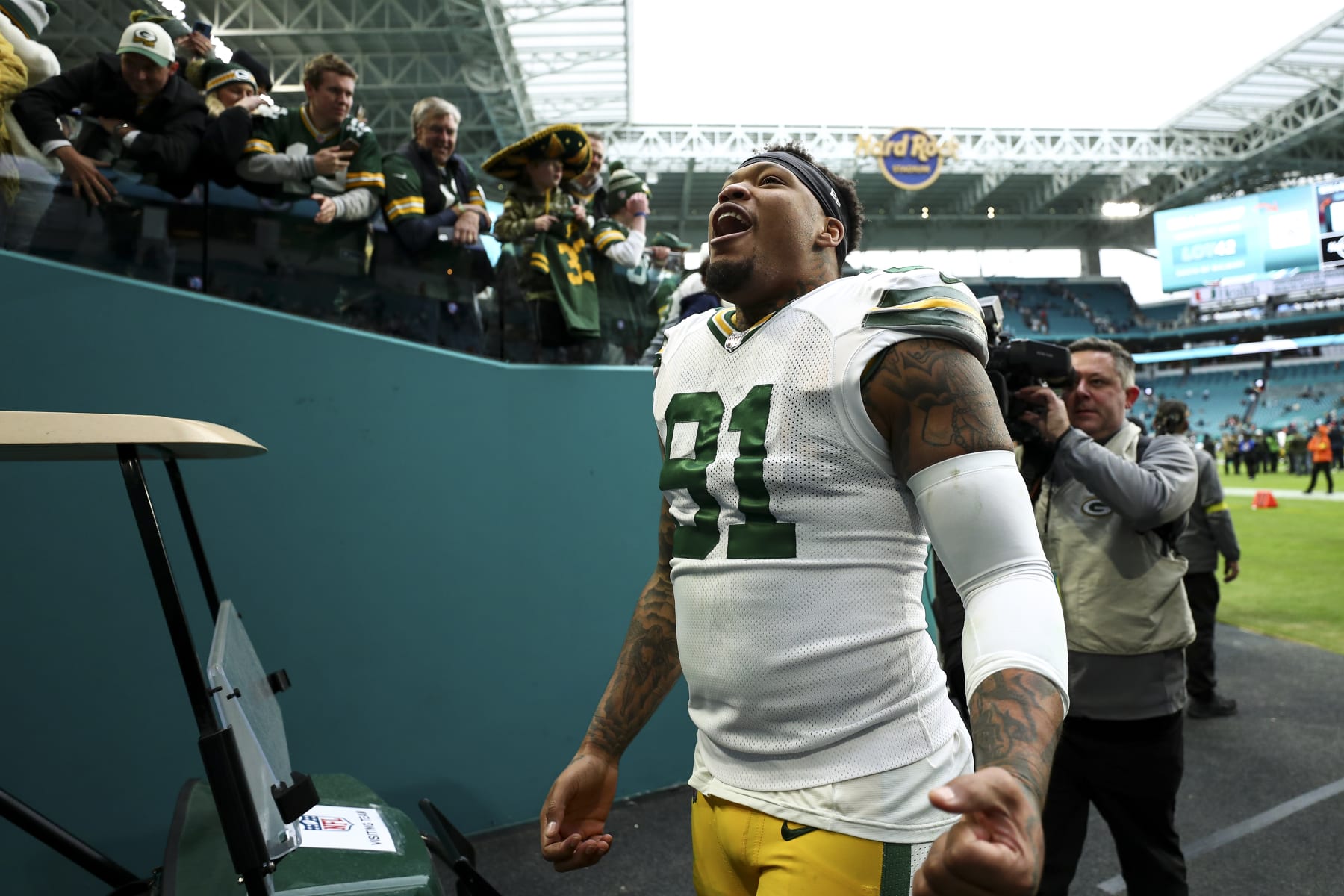 MIAMI GARDENS, FL - DECEMBER 25: Preston Smith #91 of the Green Bay Packers smiles in the tunnel after an NFL football game against the Miami Dolphins at Hard Rock Stadium on December 25, 2022 in Miami Gardens, Florida. (Photo by Kevin Sabitus/Getty Images)