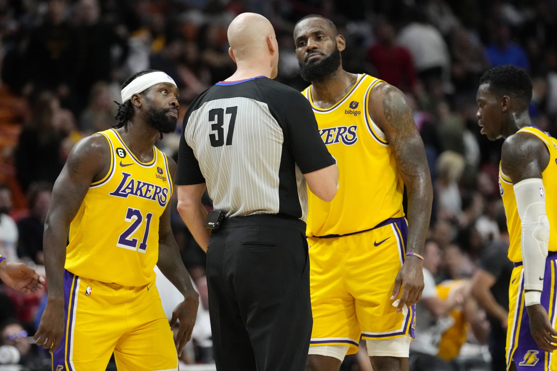 Los Angeles Lakers guard Patrick Beverley (21) and forward LeBron James, right, talks with referee Eric Dalen (37) during the second half of an NBA basketball game against the Miami Heat, Wednesday, Dec. 28, 2022, in Miami. The Heat won 112-98. (AP Photo/Lynne Sladky)