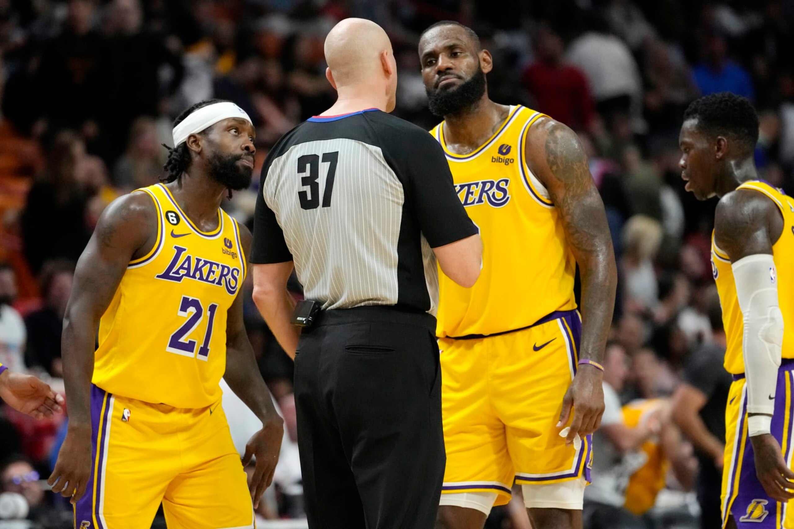 Los Angeles Lakers guard Patrick Beverley (21) and forward LeBron James, right, talks with referee Eric Dalen (37) during the second half of an NBA basketball game against the Miami Heat, Wednesday, Dec. 28, 2022, in Miami. The Heat won 112-98. (AP Photo/Lynne Sladky)
