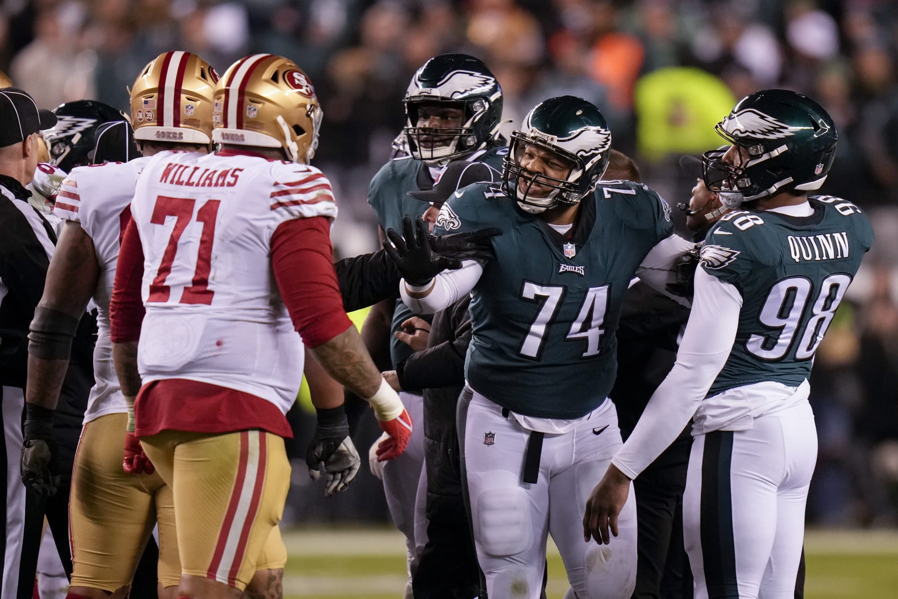 Philadelphia Eagles defensive tackle Ndamukong Suh (74) talks with San Francisco 49ers offensive tackle Trent Williams (71) during the second half of the NFC Championship NFL football game between the Philadelphia Eagles and the San Francisco 49ers on Sunday, Jan. 29, 2023, in Philadelphia. (AP Photo/Seth Wenig)