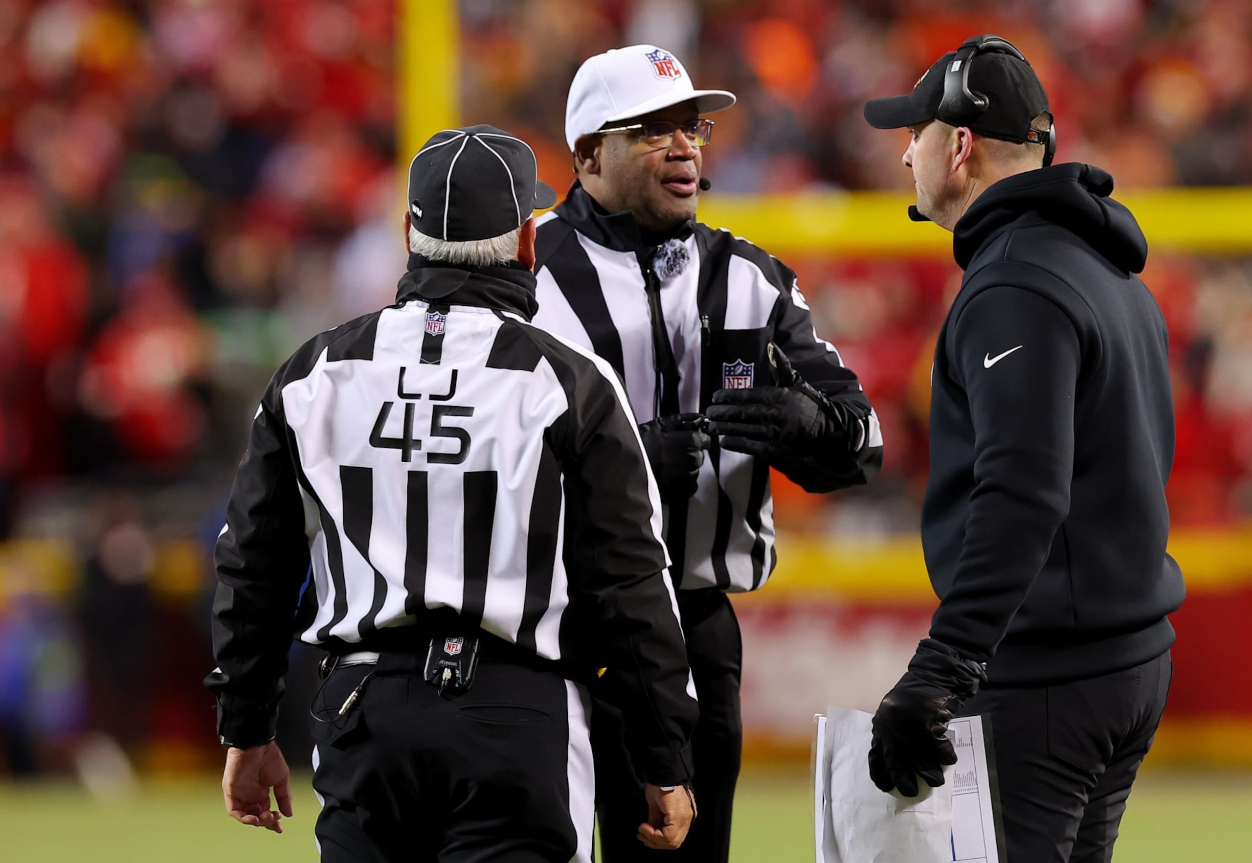 KANSAS CITY, MISSOURI - JANUARY 29: Head coach Zac Taylor of the Cincinnati Bengals (R) talks with referee Ronald Torbert #62 and line judge Jeff Seeman #45 (L) during the second half against the Kansas City Chiefs in the AFC Championship Game at GEHA Field at Arrowhead Stadium on January 29, 2023 in Kansas City, Missouri. (Photo by Kevin C. Cox/Getty Images)