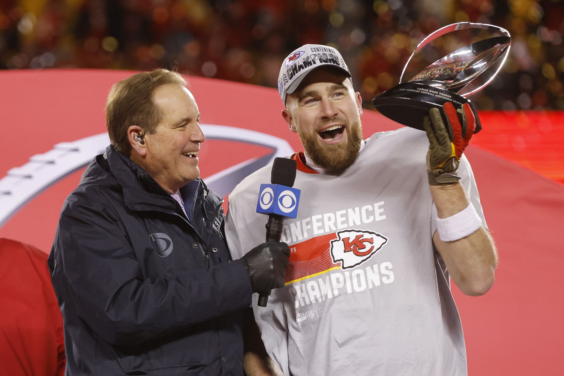 KANSAS CITY, MISSOURI - JANUARY 29: Travis Kelce #87 of the Kansas City Chiefs holds up the Lamar Hunt Trophy after defeating the Cincinnati Bengals 23-20 in the AFC Championship Game at GEHA Field at Arrowhead Stadium on January 29, 2023 in Kansas City, Missouri. (Photo by David Eulitt/Getty Images)