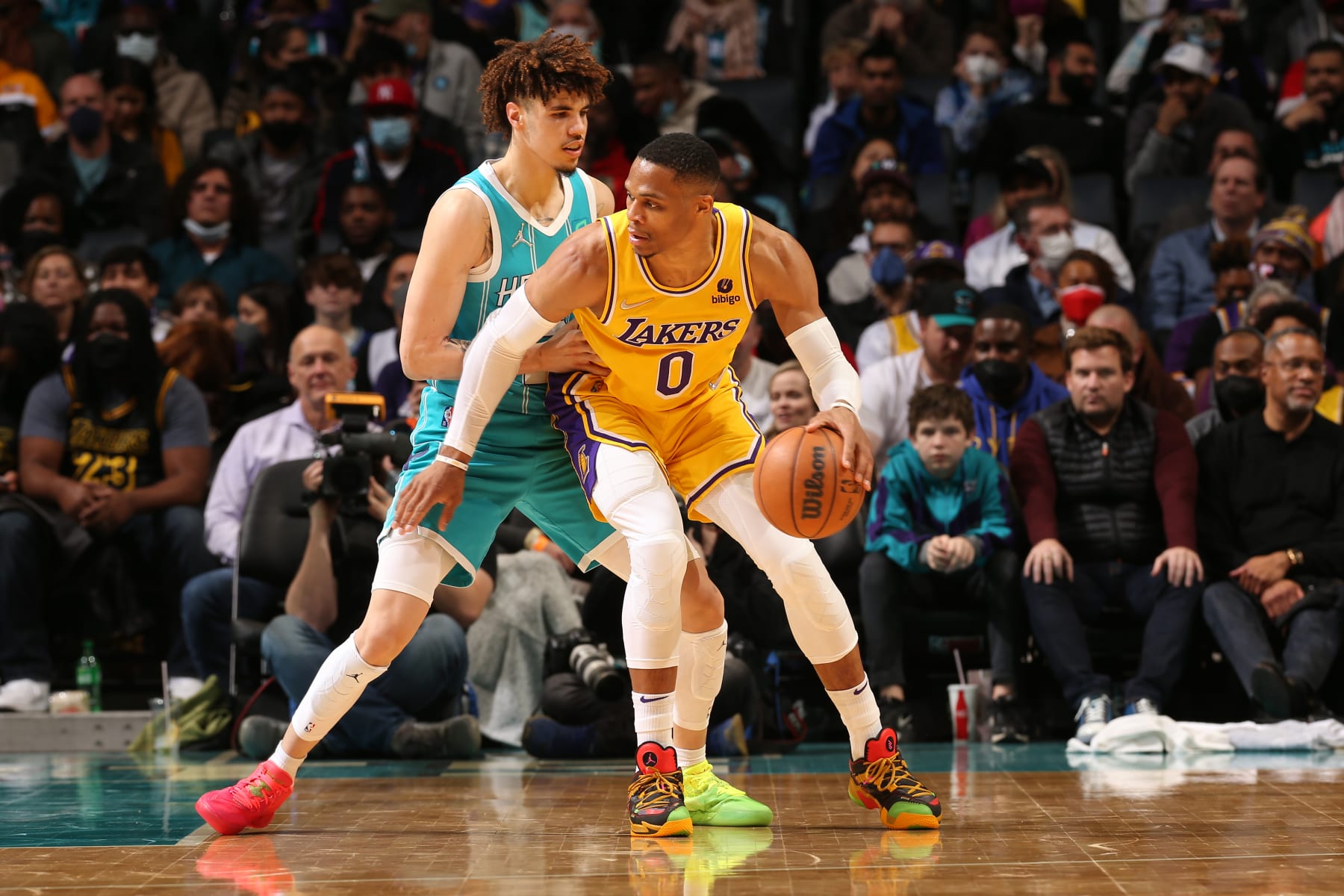 CHARLOTTE, NC - JANUARY 28: LaMelo Ball #2 of the Charlotte Hornets plays defense on Russell Westbrook #0 of the Los Angeles Lakers during the game on January 28, 2022 at Spectrum Center in Charlotte, North Carolina. NOTE TO USER: User expressly acknowledges and agrees that, by downloading and or using this photograph, User is consenting to the terms and conditions of the Getty Images License Agreement. Mandatory Copyright Notice: Copyright 2022 NBAE (Photo by Kent Smith/NBAE via Getty Images)