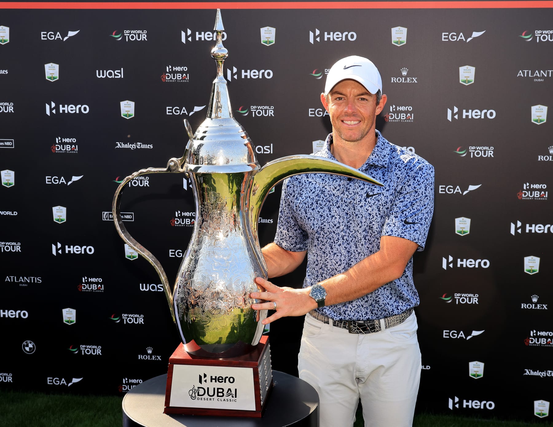 DUBAI, UNITED ARAB EMIRATES - JANUARY 30: Rory McIlroy of Northern Ireland poses with the 'Dalah' trophy after the final round on Day Five of the Hero Dubai Desert Classic on The Majlis Course at The Emirates Golf Club on January 30, 2023 in Dubai, United Arab Emirates. (Photo by David Cannon/Getty Images)