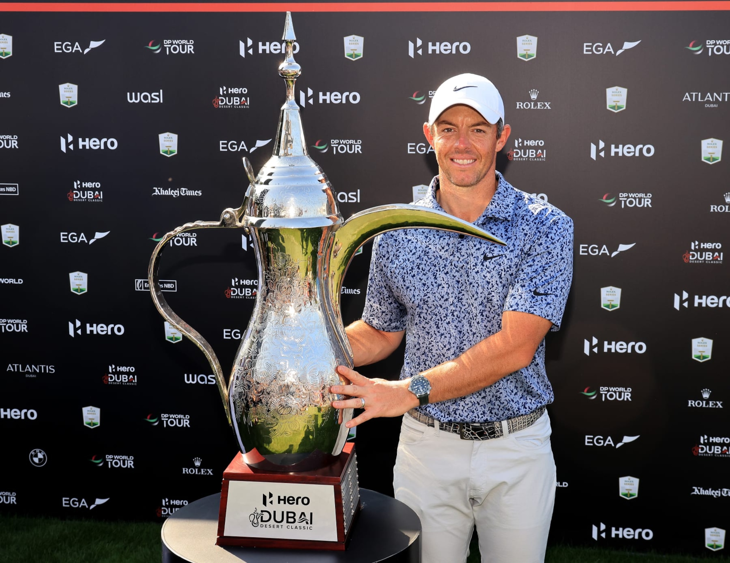 DUBAI, UNITED ARAB EMIRATES - JANUARY 30: Rory McIlroy of Northern Ireland poses with the 'Dalah' trophy after the final round on Day Five of the Hero Dubai Desert Classic on The Majlis Course at The Emirates Golf Club on January 30, 2023 in Dubai, United Arab Emirates. (Photo by David Cannon/Getty Images)