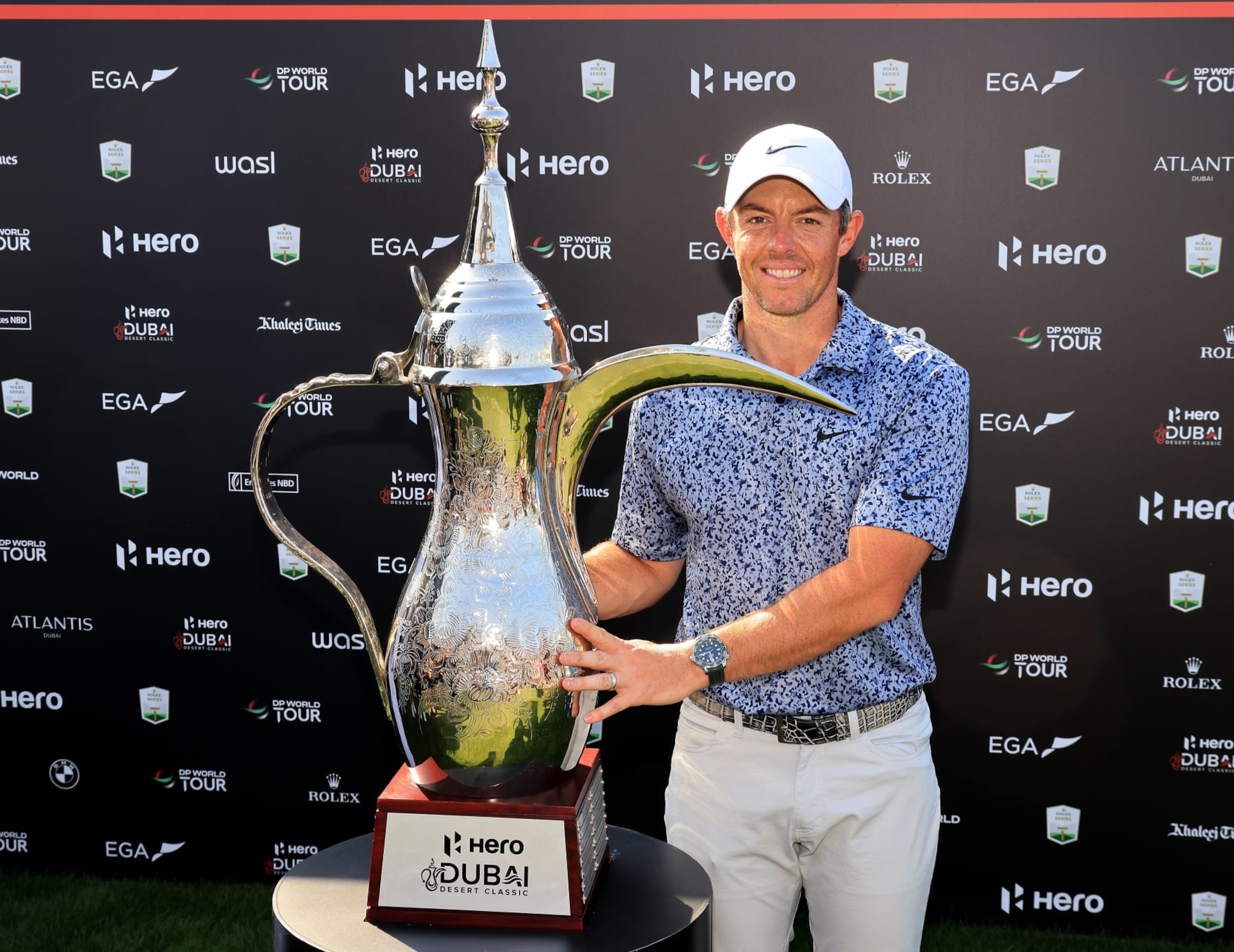 DUBAI, UNITED ARAB EMIRATES - JANUARY 30: Rory McIlroy of Northern Ireland poses with the 'Dalah' trophy after the final round on Day Five of the Hero Dubai Desert Classic on The Majlis Course at The Emirates Golf Club on January 30, 2023 in Dubai, United Arab Emirates. (Photo by David Cannon/Getty Images) DUBAI, UNITED ARAB EMIRATES - JANUARY 30: Rory McIlroy of Northern Ireland poses with the 'Dalah' trophy after the final round on Day Five of the Hero Dubai Desert Classic on The Majlis Course at The Emirates Golf Club on January 30, 2023 in Dubai, United Arab Emirates. (Photo by David Cannon/Getty Images)