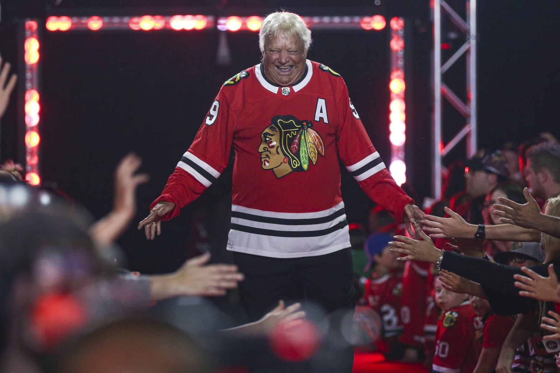 FILE - Former Chicago Blackhawks player Bobby Hull is introduced to fans during the NHL hockey team's convention in Chicago, Friday, July 26, 2019. Hall of Fame forward Bobby Hull is no longer serving as a team ambassador for the Chicago Blackhawks. "When it comes to Bobby, specifically, we jointly agreed earlier this season that he will retire from any official team role,” the team said in a statement Monday, Feb. 21, 2022. (AP Photo/Amr Alfiky, File)
