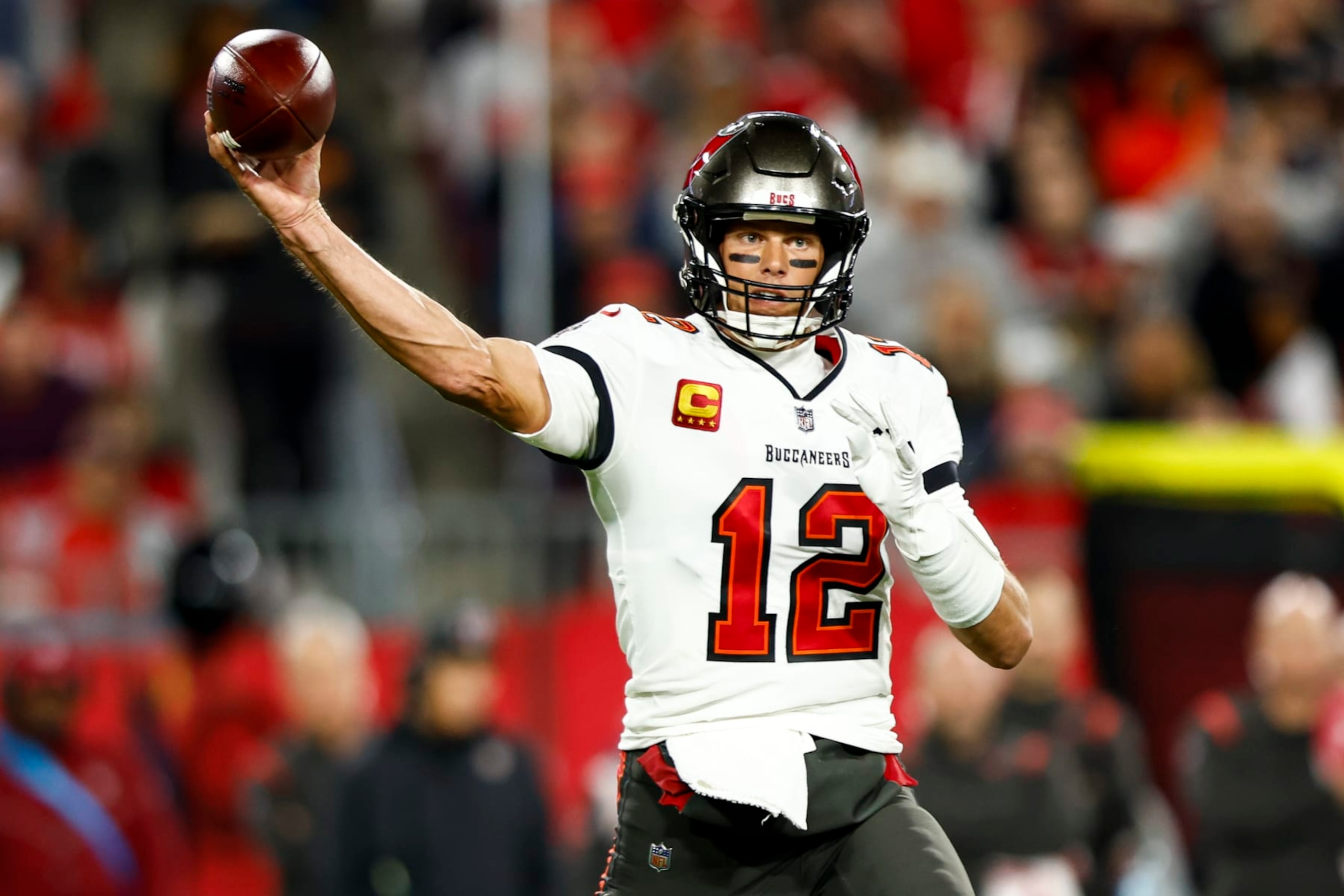 TAMPA, FL - JANUARY 16: Tom Brady #12 of the Tampa Bay Buccaneers throws a pass during the second quarter of an NFL wild card playoff football game against the Dallas Cowboys at Raymond James Stadium on January 16, 2023 in Tampa, Florida. (Photo by Kevin Sabitus/Getty Images) TAMPA, FL - JANUARY 16: Tom Brady #12 of the Tampa Bay Buccaneers throws a pass during the second quarter of an NFL wild card playoff football game against the Dallas Cowboys at Raymond James Stadium on January 16, 2023 in Tampa, Florida. (Photo by Kevin Sabitus/Getty Images)