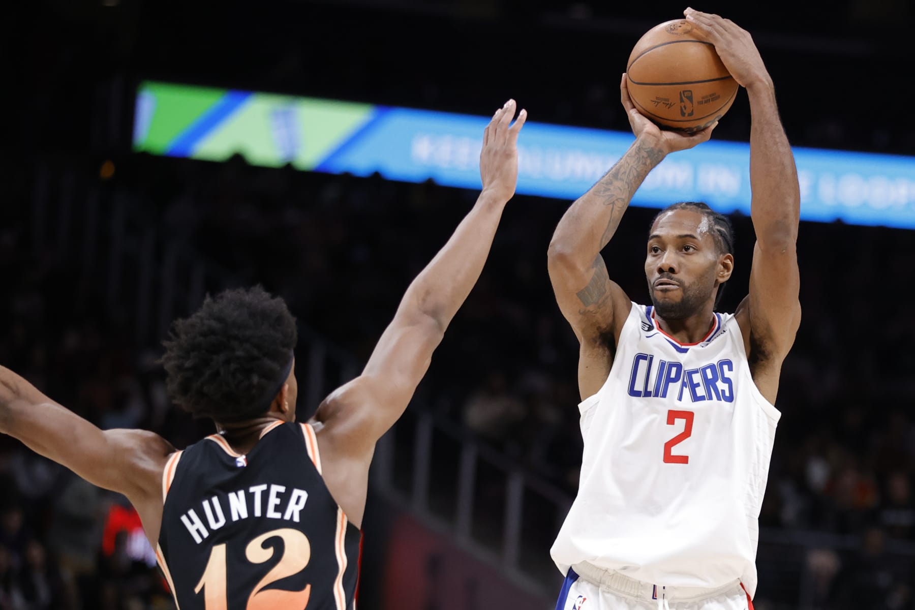 ATLANTA, GA - JANUARY 28: Kawhi Leonard #2 of the LA Clippers takes a shot over De'Andre Hunter #12 of the Atlanta Hawks during the second half at State Farm Arena on January 28, 2023 in Atlanta, Georgia. NOTE TO USER: User expressly acknowledges and agrees that,  by downloading and or using this photograph,  User is consenting to the terms and conditions of the Getty Images License Agreement. (Photo by Alex Slitz/Getty Images)