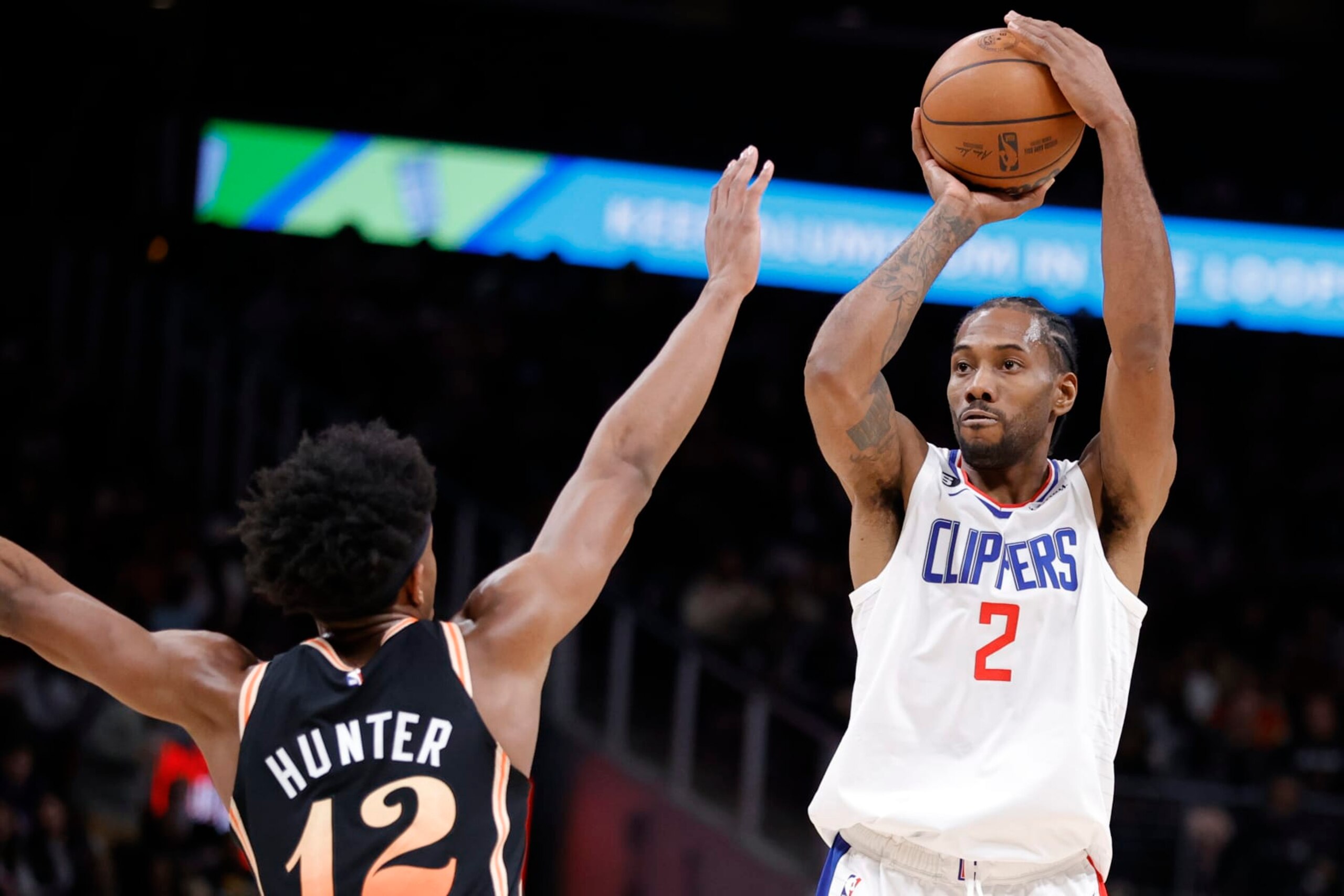 ATLANTA, GA - JANUARY 28: Kawhi Leonard #2 of the LA Clippers takes a shot over De'Andre Hunter #12 of the Atlanta Hawks during the second half at State Farm Arena on January 28, 2023 in Atlanta, Georgia. NOTE TO USER: User expressly acknowledges and agrees that,  by downloading and or using this photograph,  User is consenting to the terms and conditions of the Getty Images License Agreement. (Photo by Alex Slitz/Getty Images)