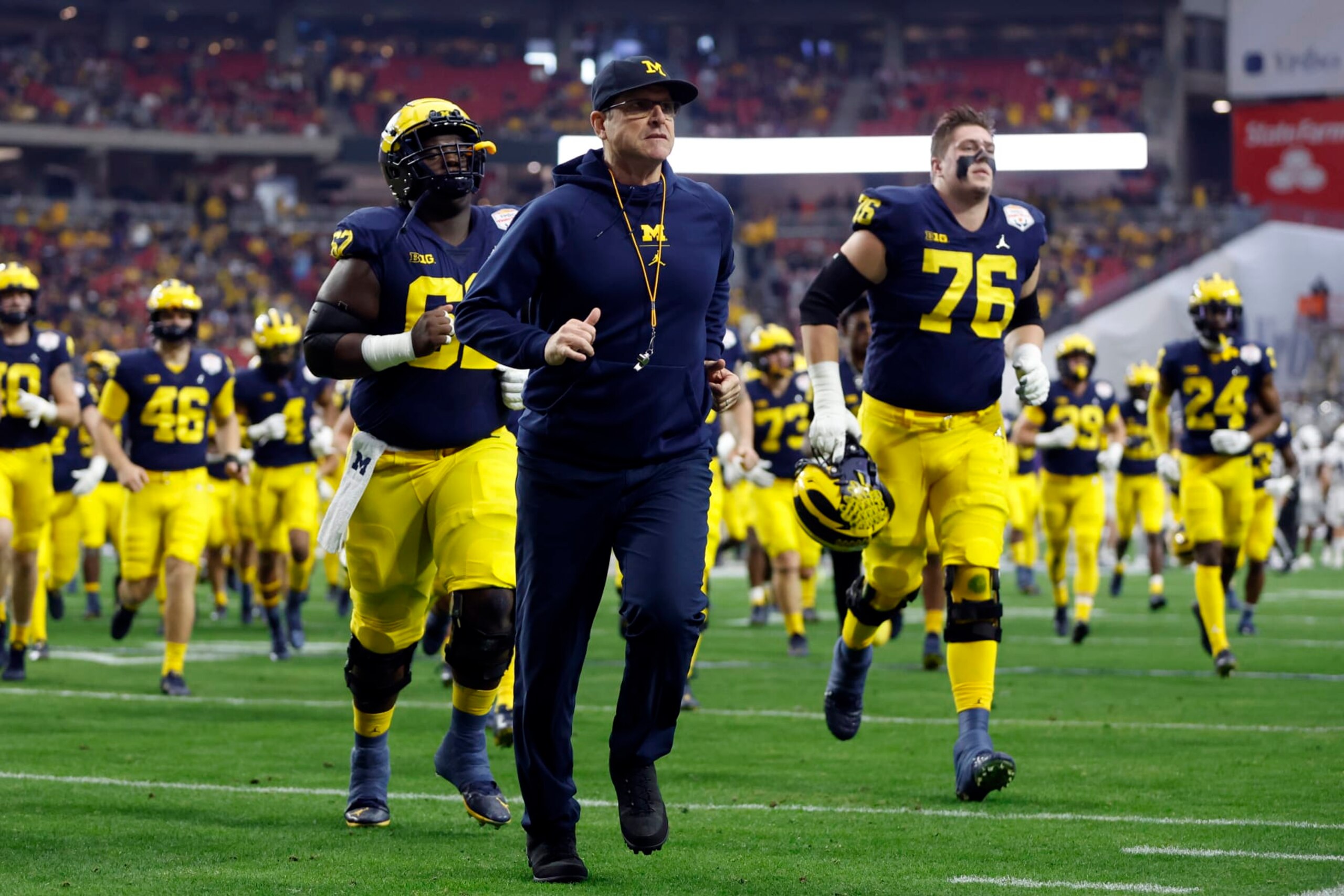 GLENDALE, ARIZONA - DECEMBER 31: Head coach Jim Harbaugh of the Michigan Wolverines leaves the field before the Vrbo Fiesta Bowl against the TCU Horned Frogs at State Farm Stadium on December 31, 2022 in Glendale, Arizona. The Horned Frogs defeated the Wolverines 51-45. (Photo by Chris Coduto/Getty Images)