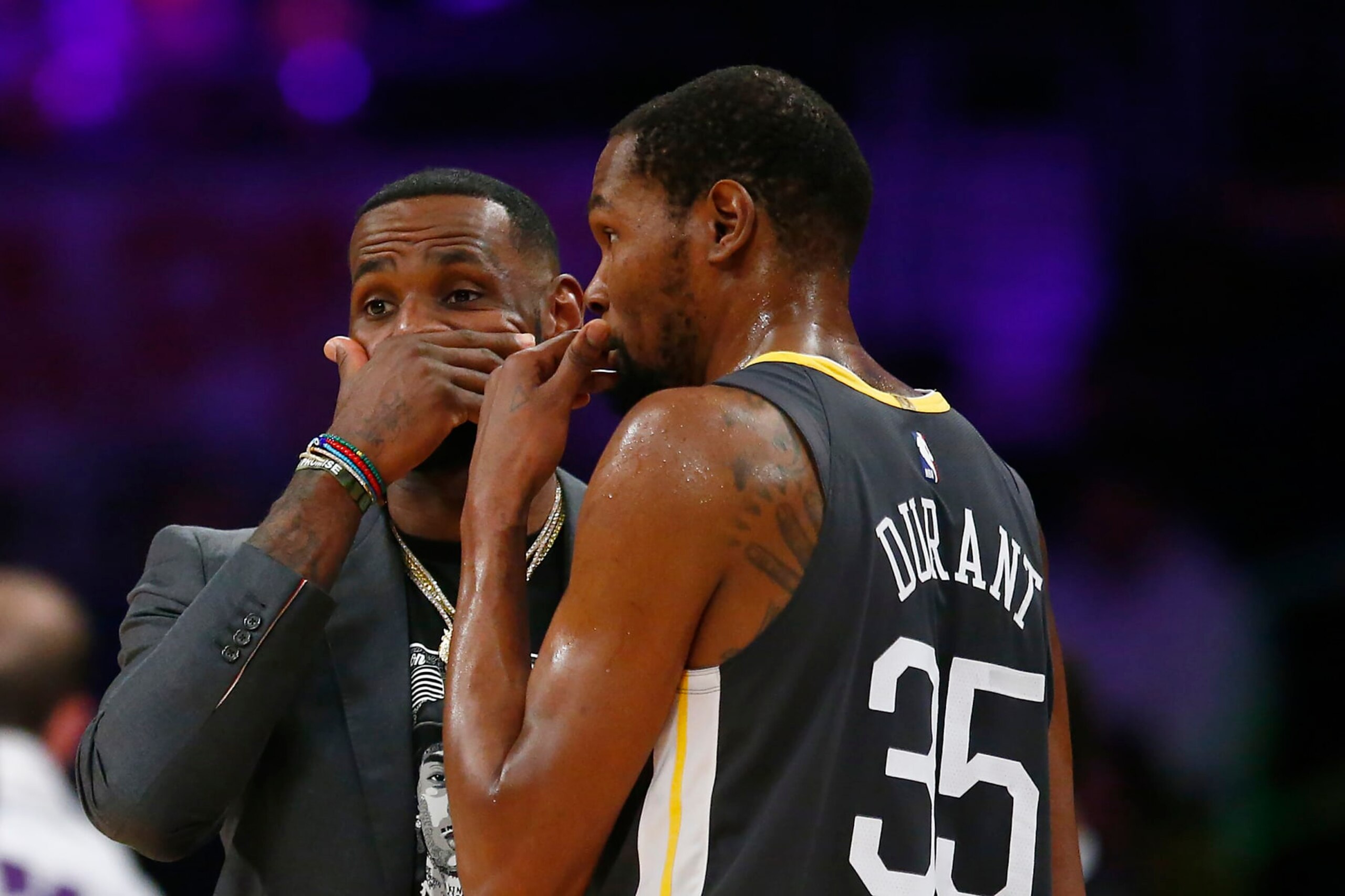 LOS ANGELES, CALIFORNIA - APRIL 04: LeBron James #23 of the Los Angeles Lakers speaks to Kevin Durant #35 of the Golden State Warriors during a timeout in the first half at Staples Center on April 04, 2019 in Los Angeles, California. NOTE TO USER: User expressly acknowledges and agrees that, by downloading and or using this photograph, User is consenting to the terms and conditions of the Getty Images License Agreement. (Photo by Yong Teck Lim/Getty Images)