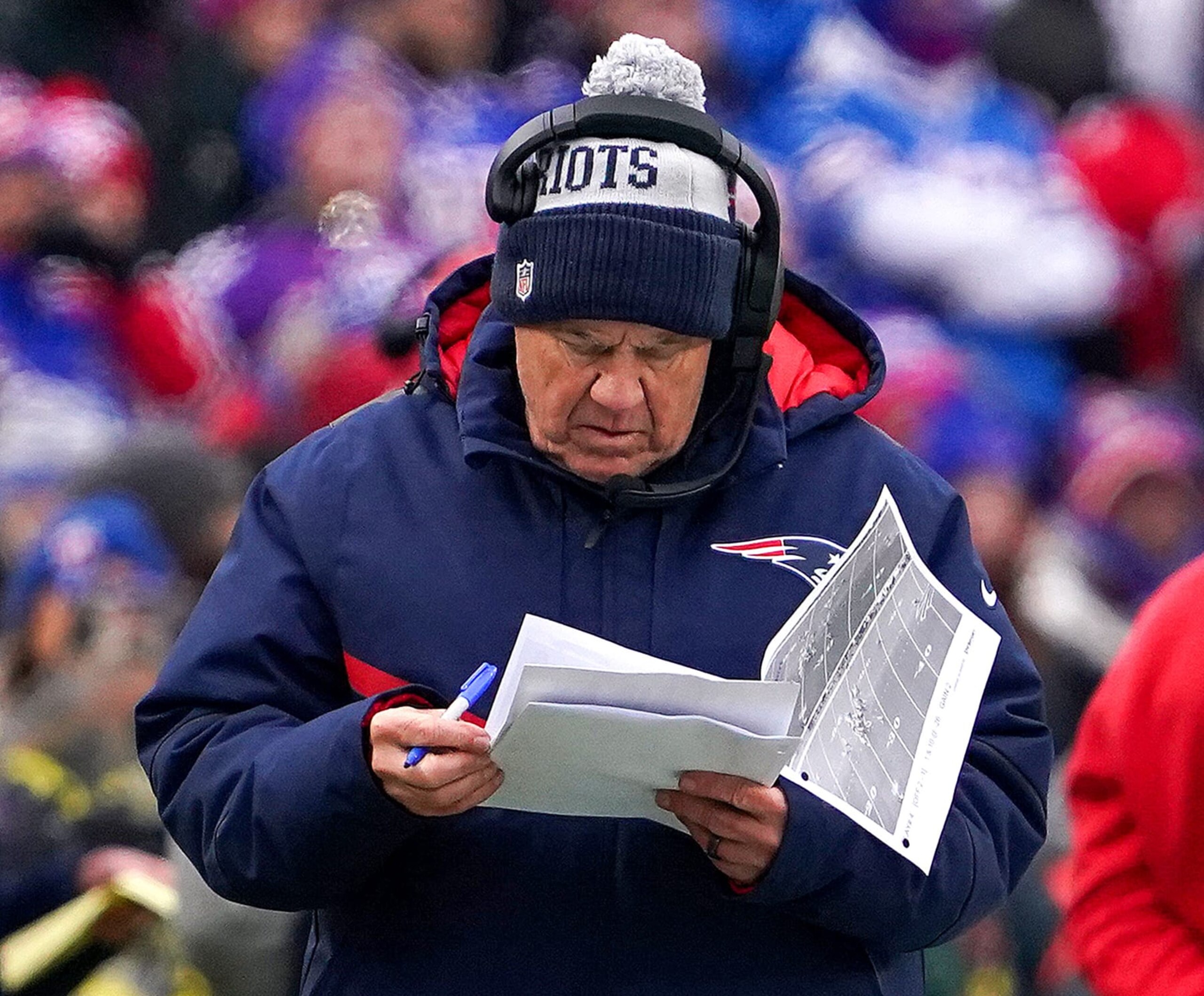 Orchard Park, NY - January 8: New England Patriots head coach Bill Belichick reviews some All-22 footage during the first quarter. The Patriots lost to the Buffalo Bills, 35-23. (Photo by Barry Chin/The Boston Globe via Getty Images)
