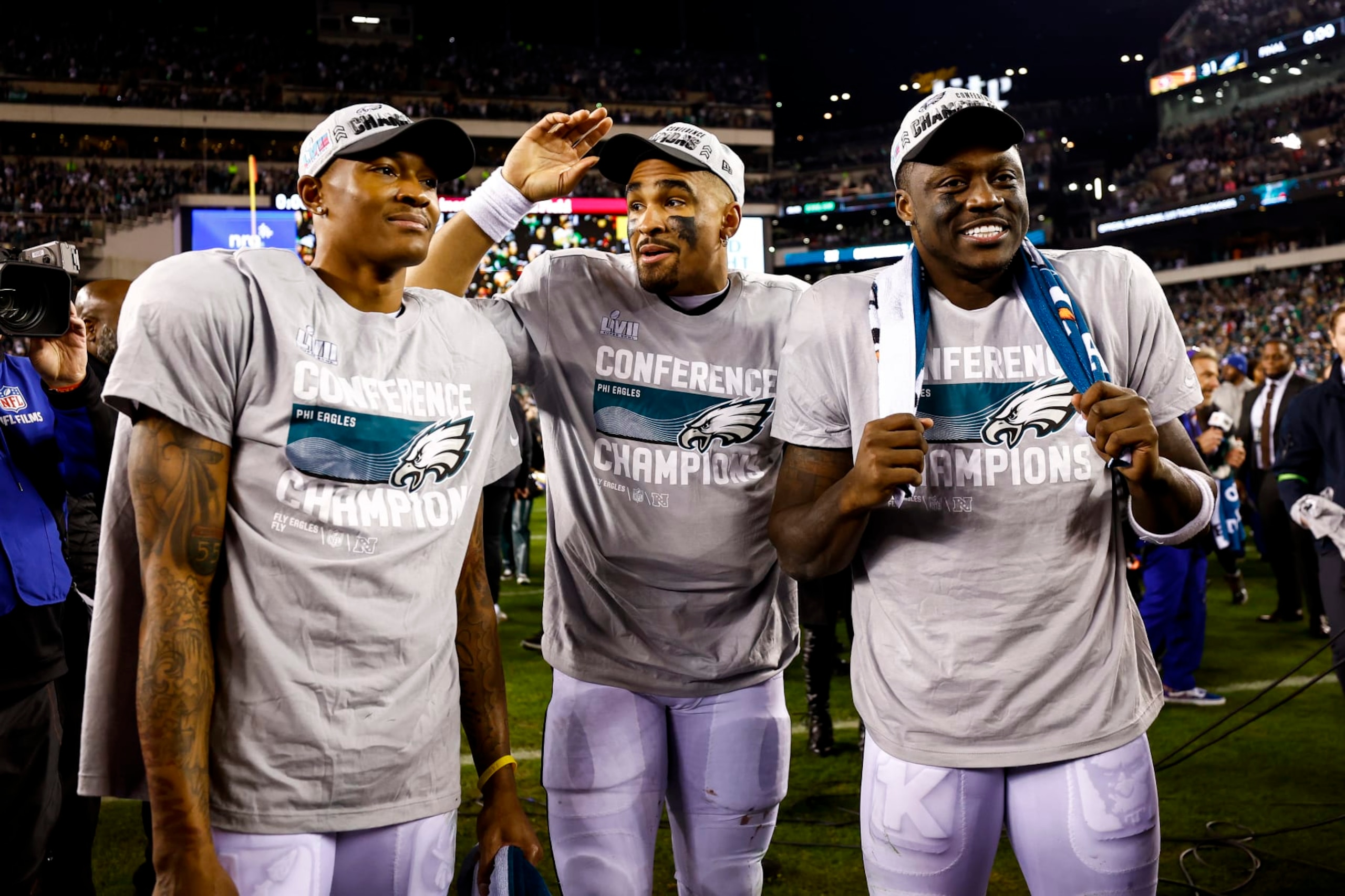 PHILADELPHIA, PA - JANUARY 29: DeVonta Smith #6, Jalen Hurts #1, and A.J. Brown #11 of the Philadelphia Eagles smile on the field after the Philadelphia Eagles beat the San Francisco 49ers in the NFC Championship NFL football game at Lincoln Financial Field on January 29, 2023 in Philadelphia, Pennsylvania. (Photo by Kevin Sabitus/Getty Images)