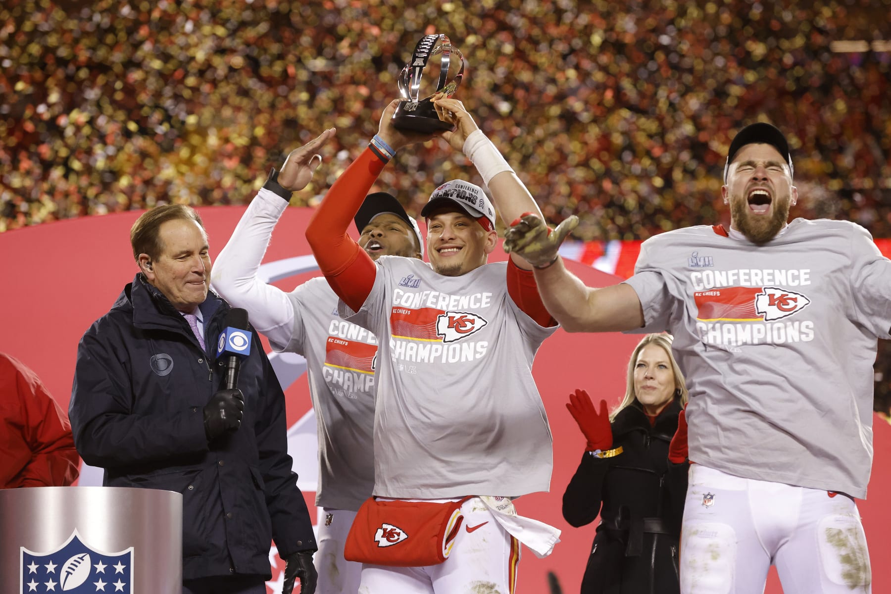 KANSAS CITY, MISSOURI - JANUARY 29: Carlos Dunlap #8, Patrick Mahomes #15 and Travis Kelce #87 of the Kansas City Chiefs celebrate after defeating the Cincinnati Bengals 23-20 in the AFC Championship Game at GEHA Field at Arrowhead Stadium on January 29, 2023 in Kansas City, Missouri. (Photo by David Eulitt/Getty Images)