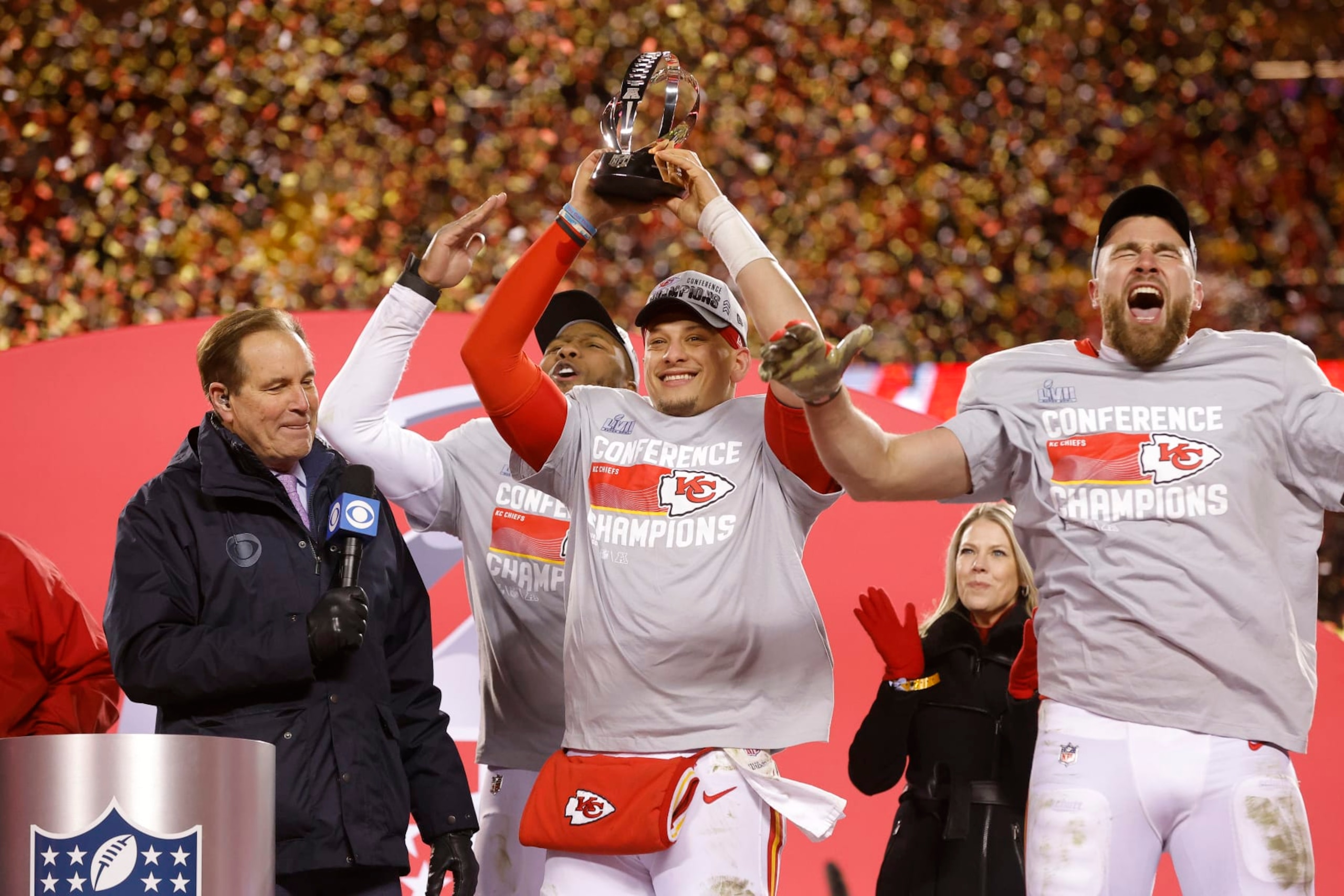 KANSAS CITY, MISSOURI - JANUARY 29: Carlos Dunlap #8, Patrick Mahomes #15 and Travis Kelce #87 of the Kansas City Chiefs celebrate after defeating the Cincinnati Bengals 23-20 in the AFC Championship Game at GEHA Field at Arrowhead Stadium on January 29, 2023 in Kansas City, Missouri. (Photo by David Eulitt/Getty Images)
